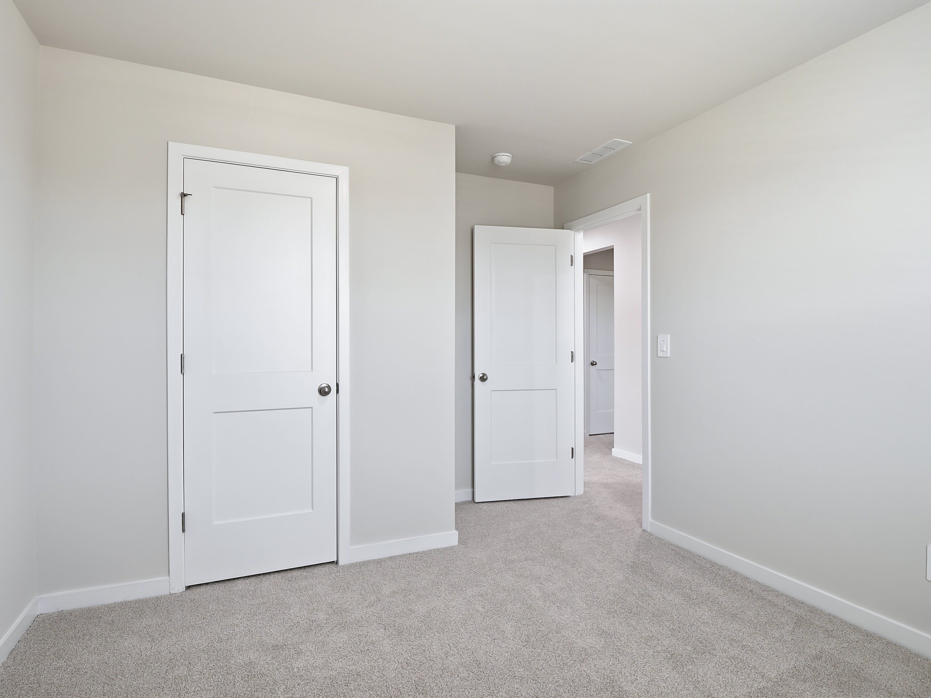 Secondary bedroom in the Dallas floorplan at a Meritage Homes community in Wendell, NC.