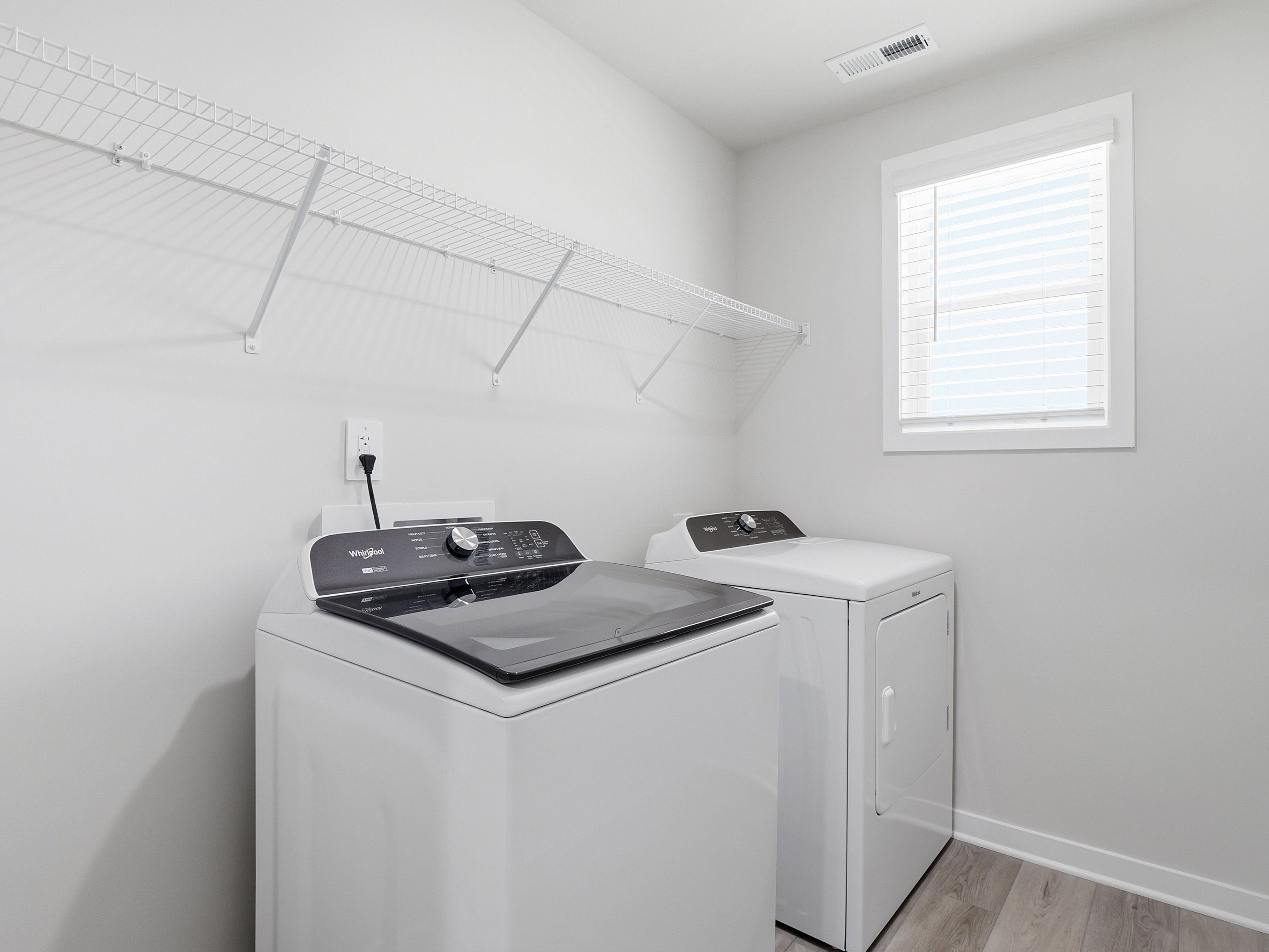 Laundry room in the Dallas floorplan at a Meritage Homes community in Wendell, NC.
