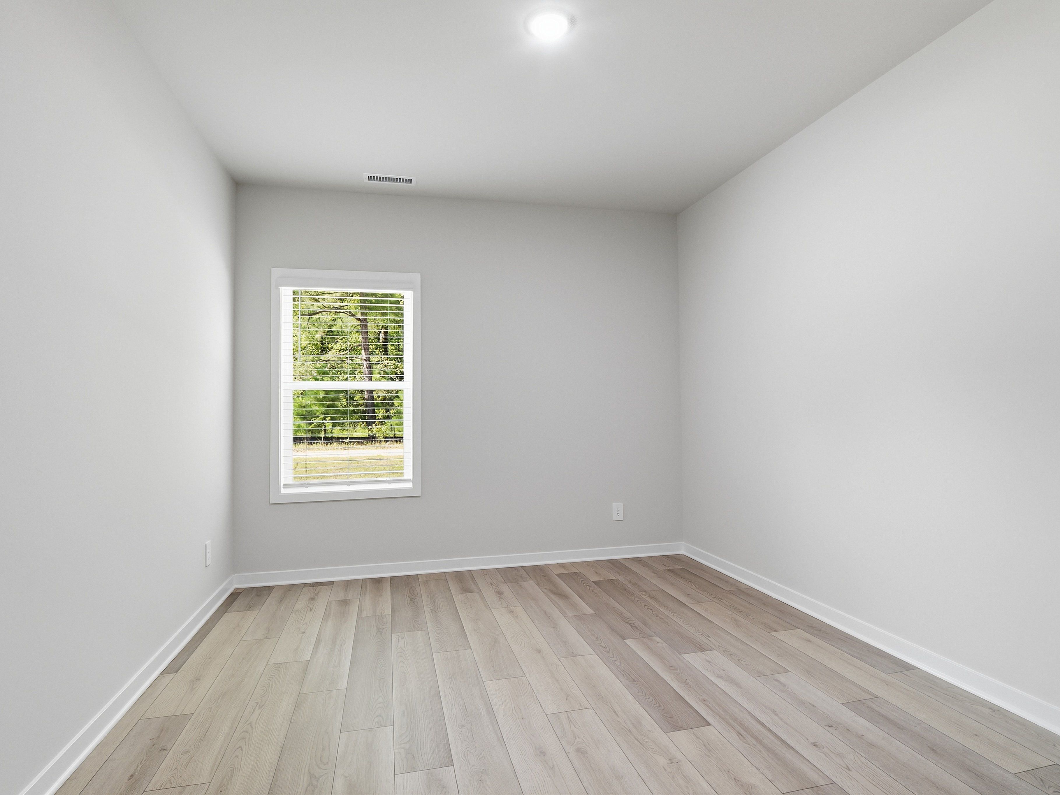 Secondary bedroom in the Johnson floorplan at a Meritage Homes community in Wendell, NC.