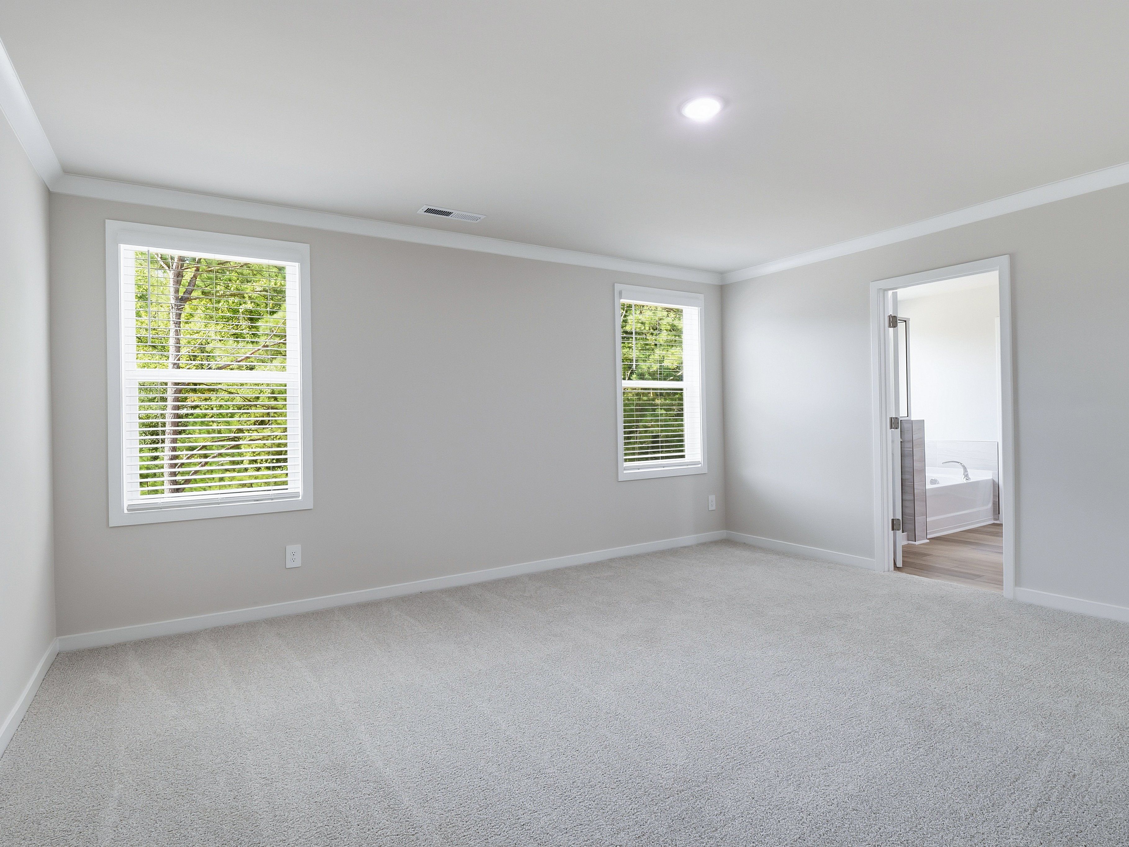 Primary bedroom in the Johnson floorplan at a Meritage Homes community in Wendell, NC.