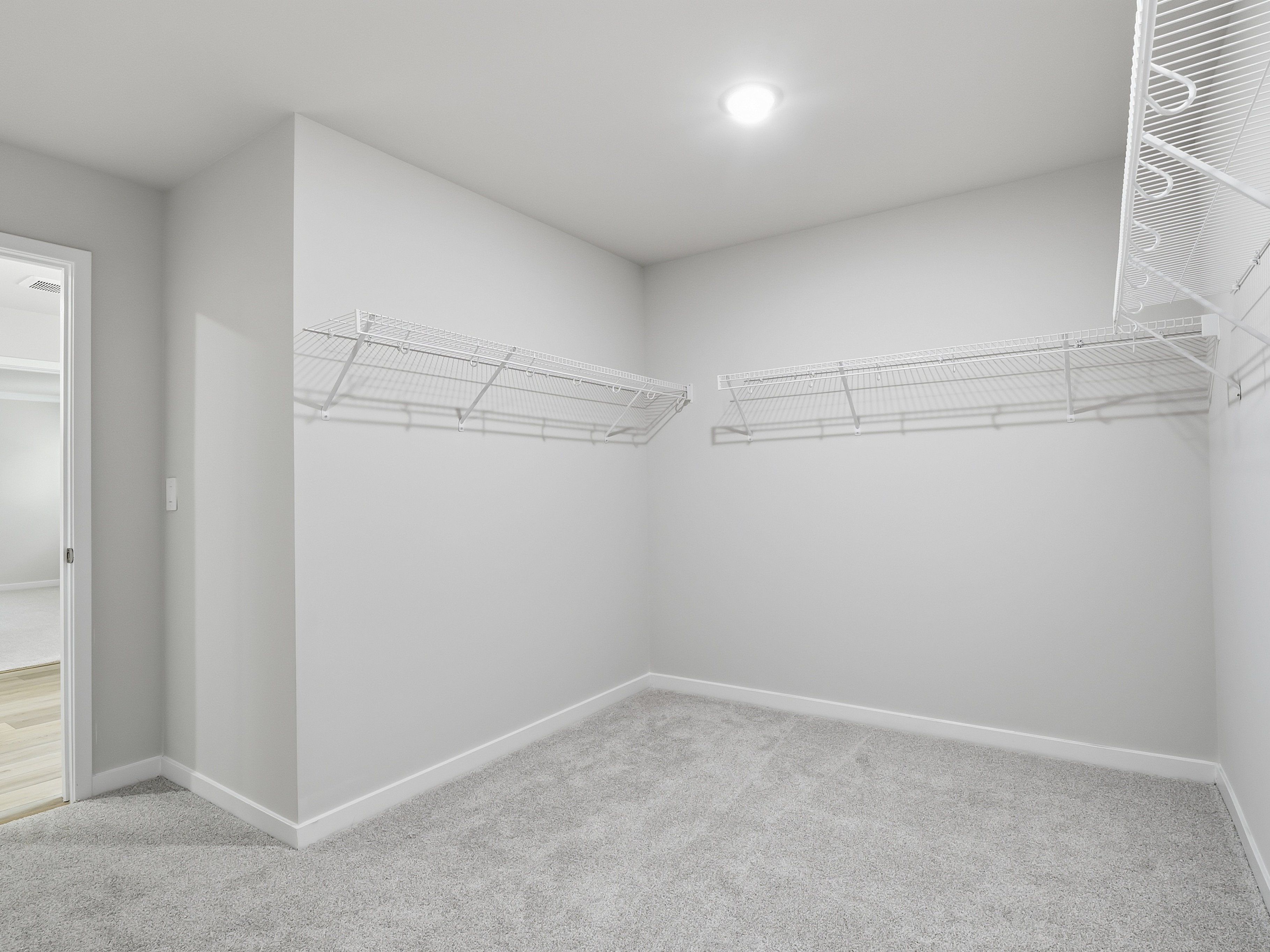Walk-in closet in the Johnson floorplan at a Meritage Homes community in Wendell, NC.