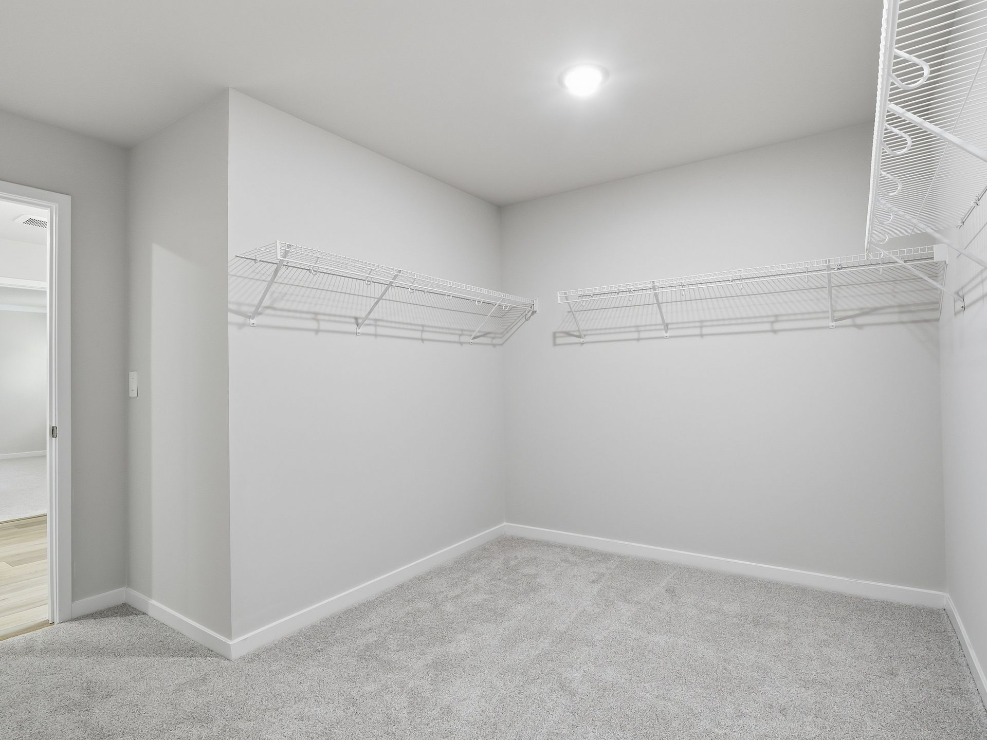 Walk-in closet in the Johnson floorplan at a Meritage Homes community in Wendell, NC.