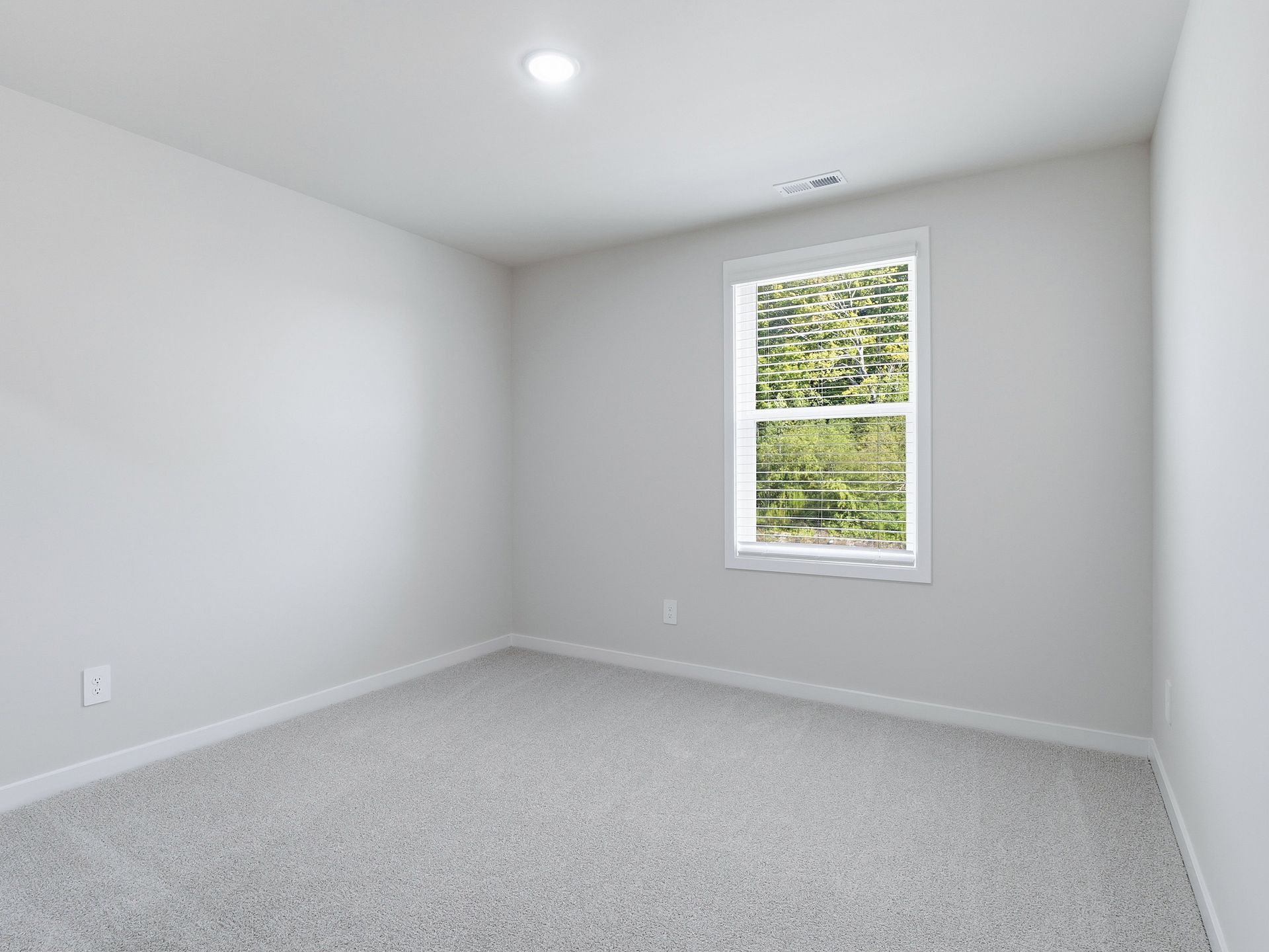 Secondary bedroom in the Johnson floorplan at a Meritage Homes community in Wendell, NC.