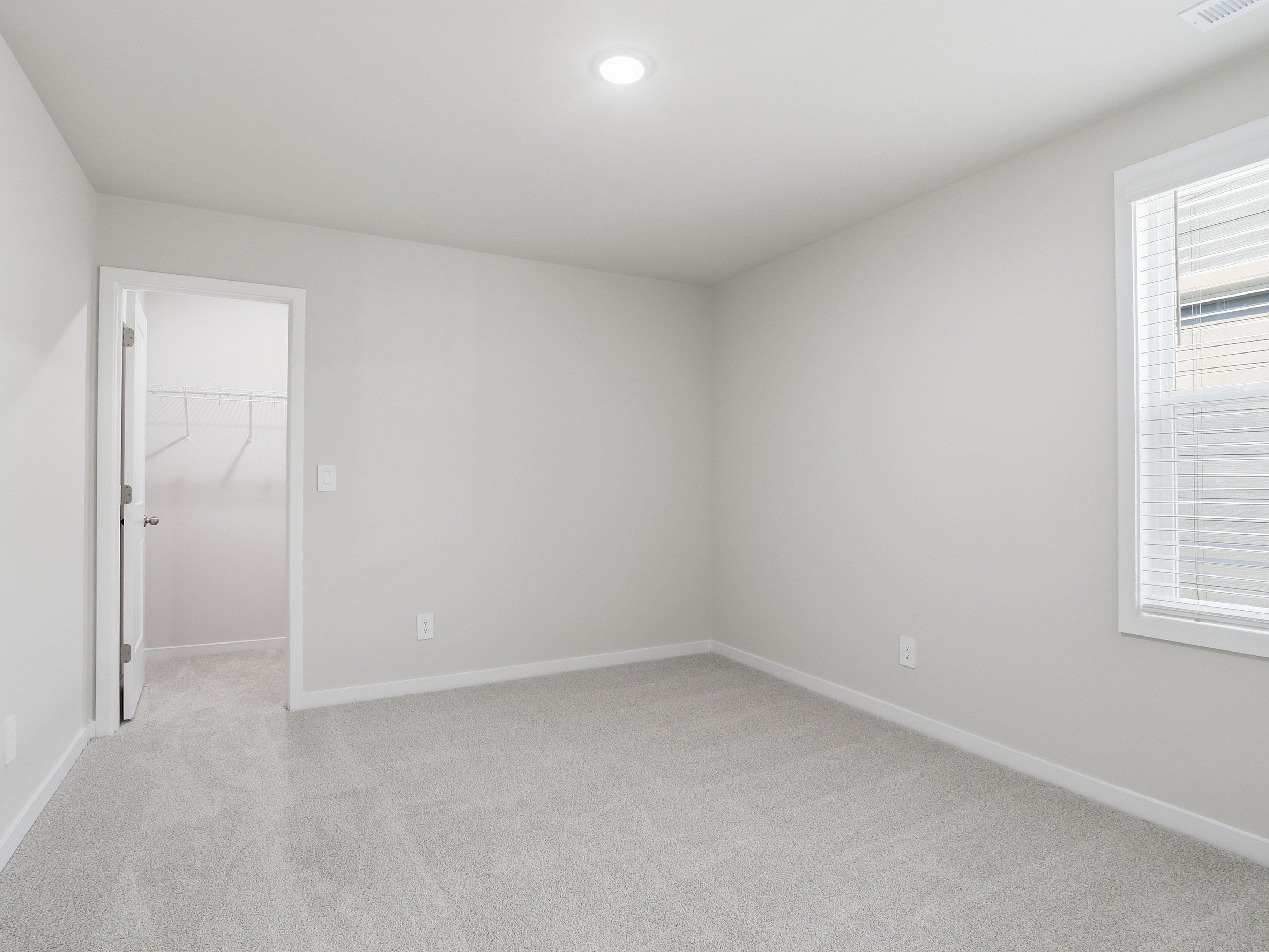 Secondary bedroom in the Johnson floorplan at a Meritage Homes community in Wendell, NC.