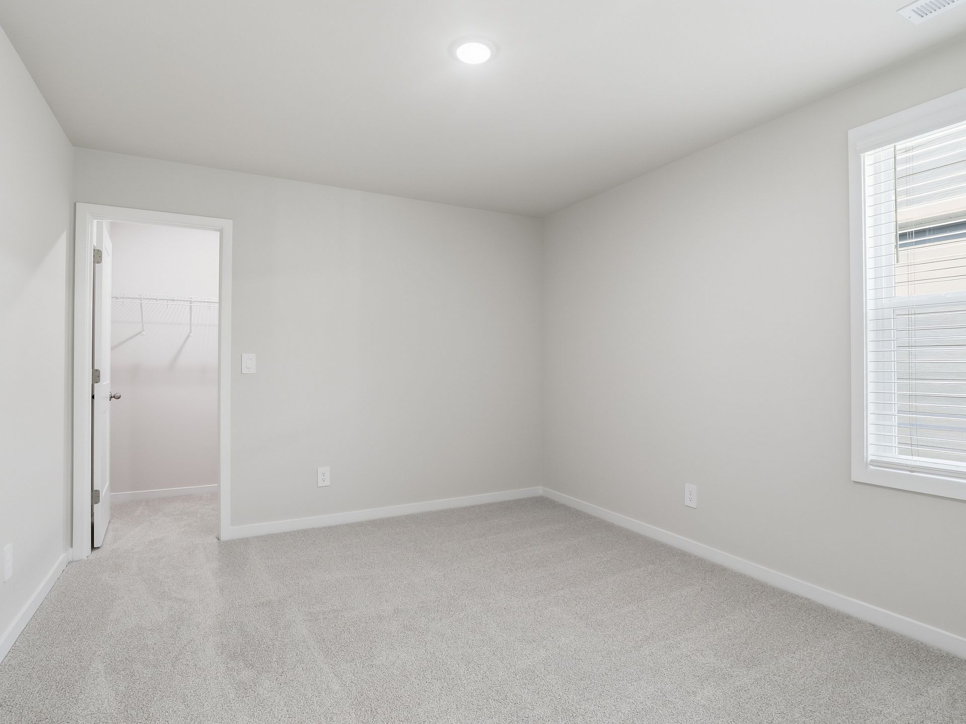 Secondary bedroom in the Johnson floorplan at a Meritage Homes community in Wendell, NC.