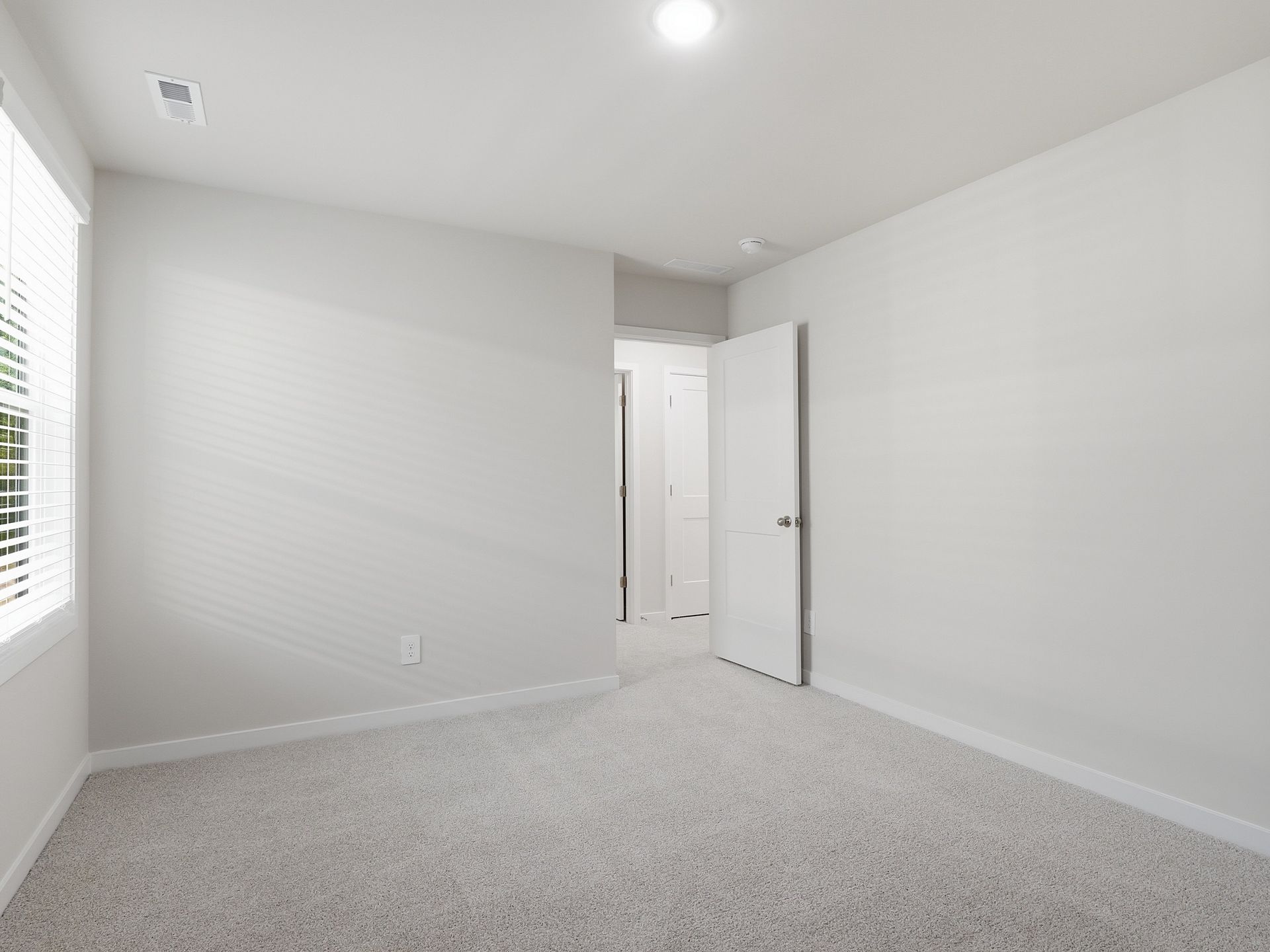 Secondary bedroom in the Johnson floorplan at a Meritage Homes community in Wendell, NC.