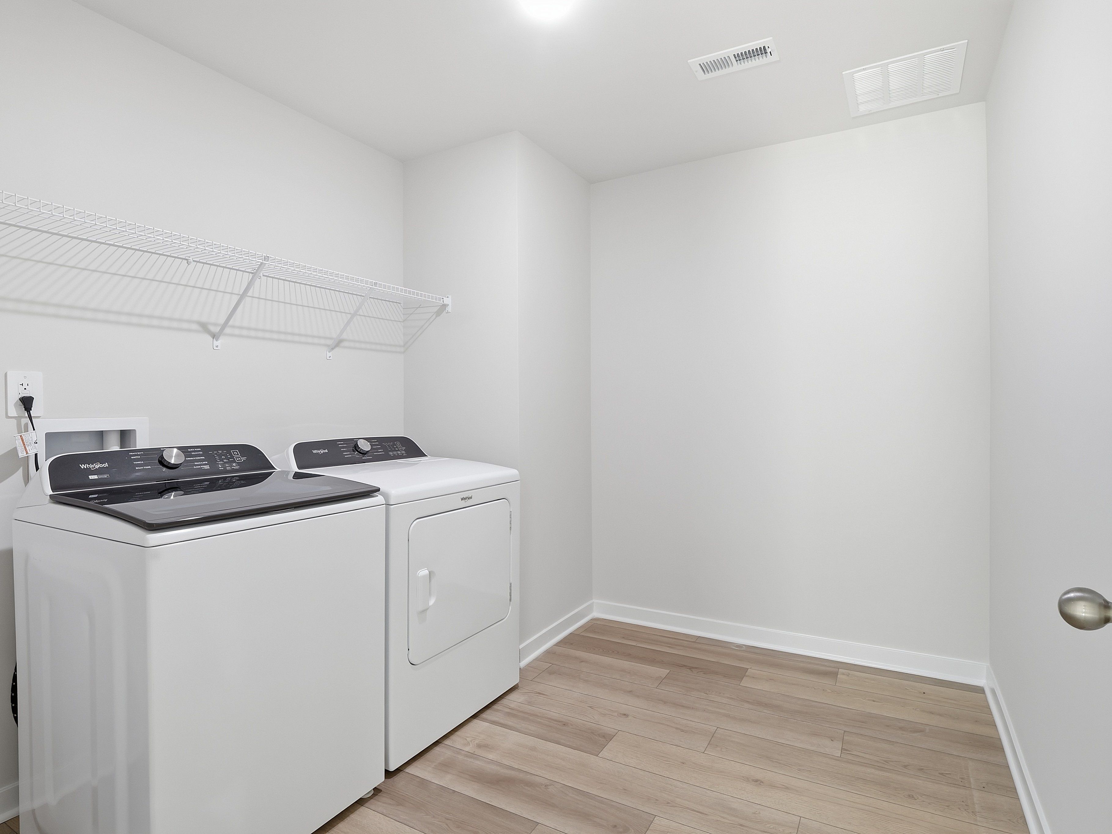 Laundry room in the Johnson floorplan at a Meritage Homes community in Wendell, NC.