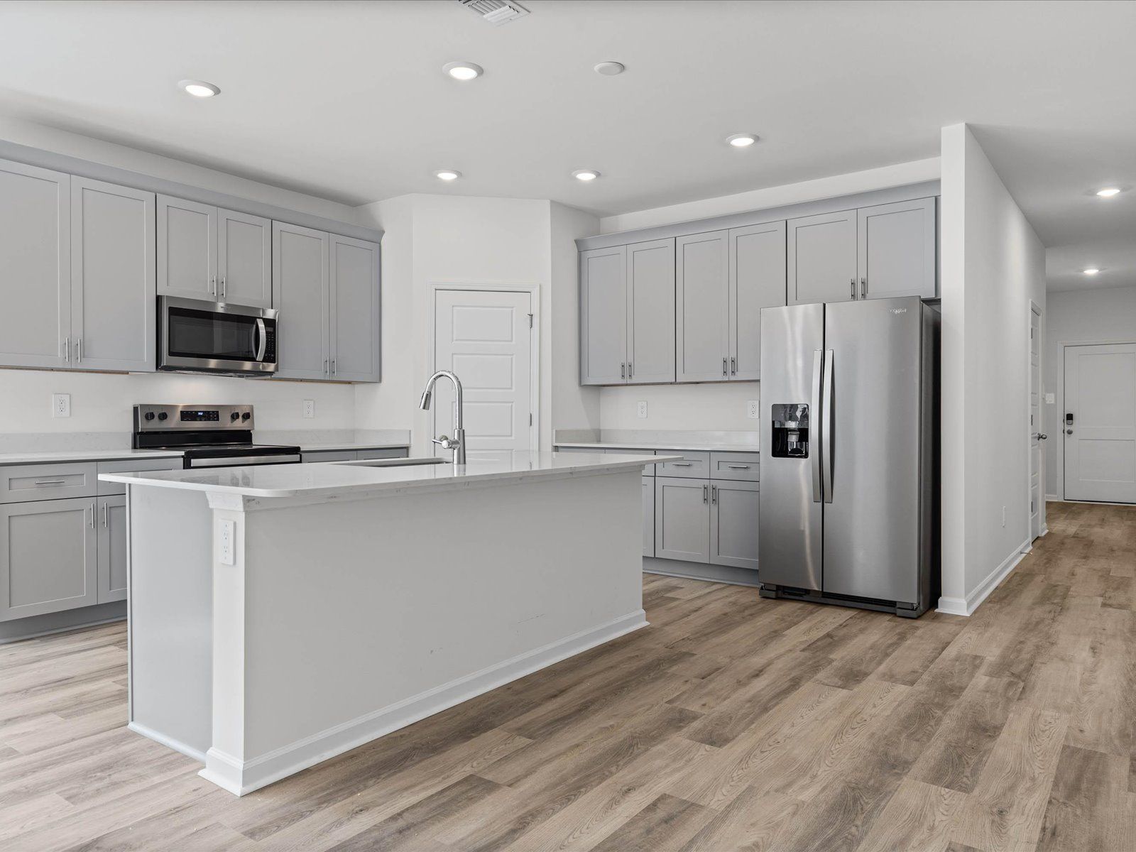 Kitchen in the Newport floorplan at a Meritage Homes community in Gulfport, MS.