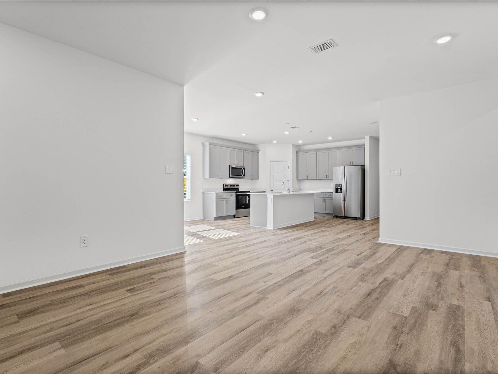 Great Room in the Newport floorplan at a Meritage Homes community in Gulfport, MS.