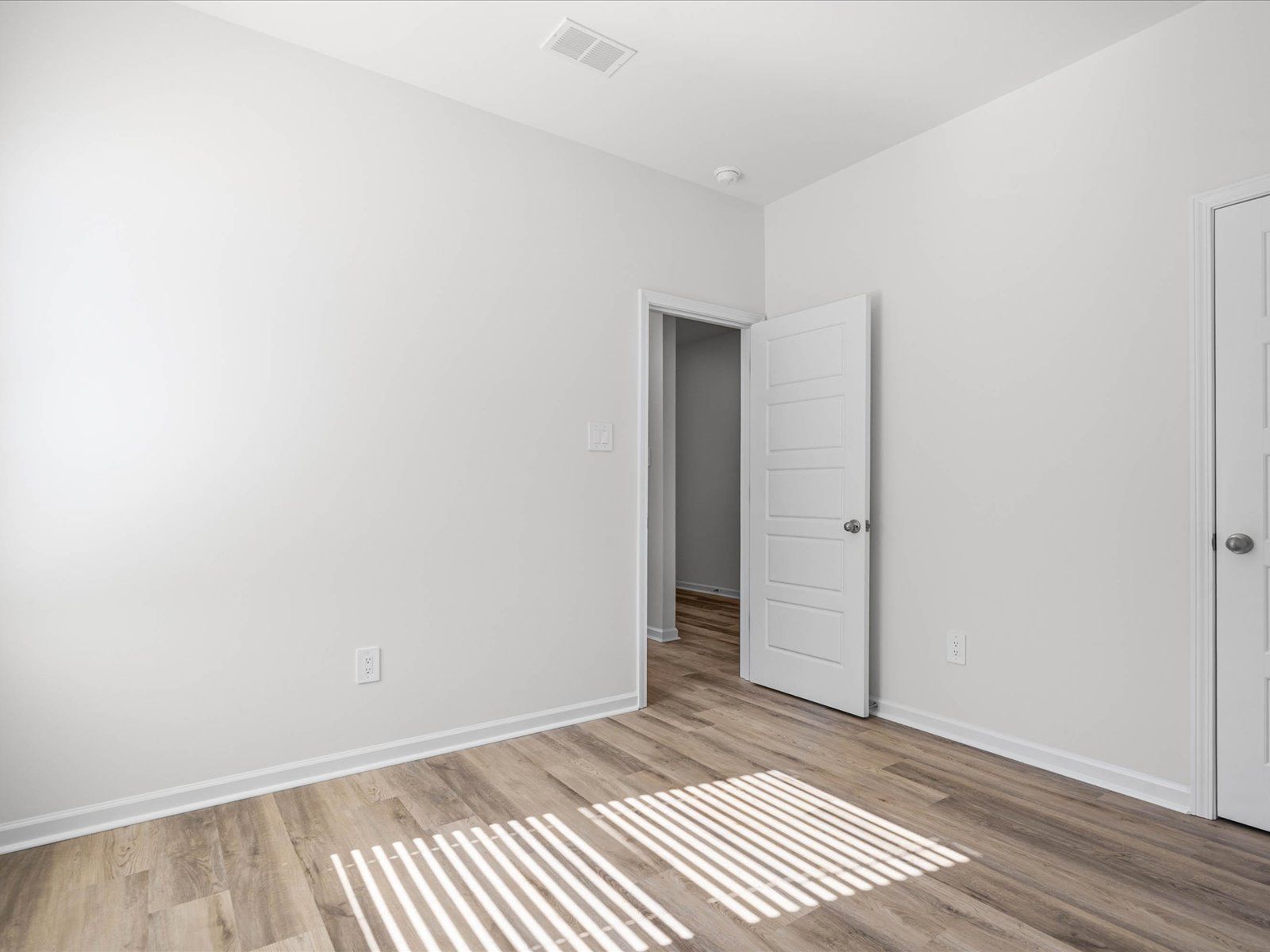 Secondary Bedroom in the Newport floorplan at a Meritage Homes community in Gulfport, MS.