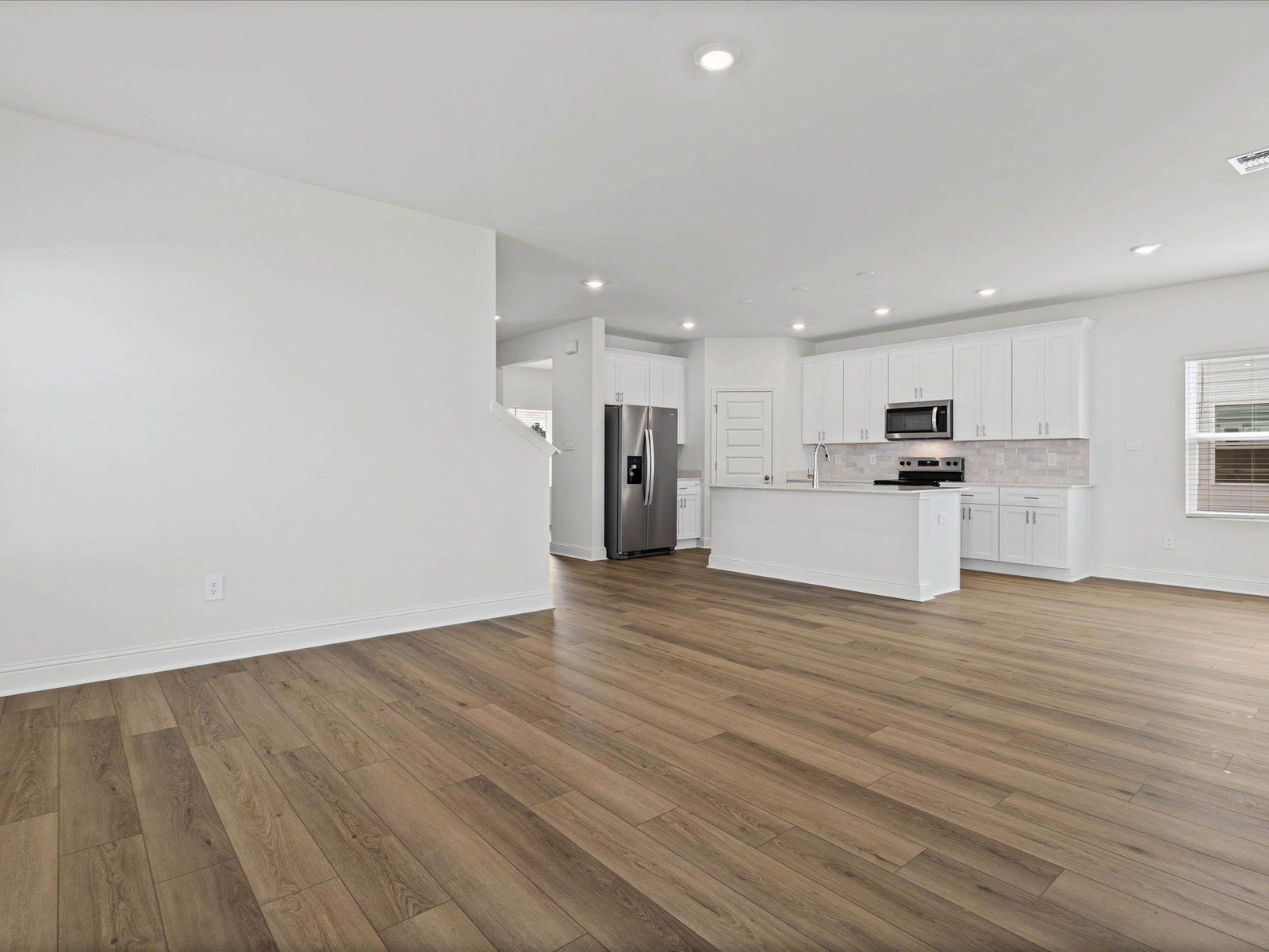 Great Room in the Fraser floorplan at a Meritage Homes community in Ocean Springs, MS.
