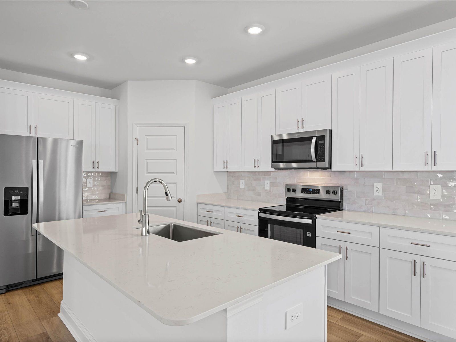 Kitchen in the Fraser floorplan at a Meritage Homes community in Ocean Springs, MS.