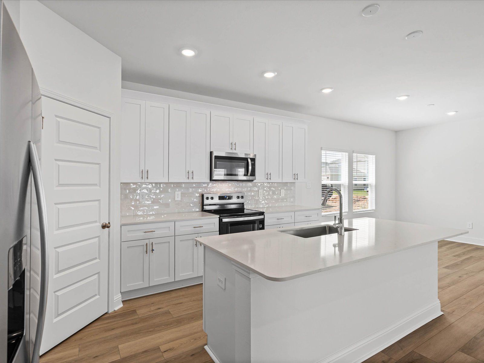 Kitchen in the Fraser floorplan at a Meritage Homes community in Ocean Springs, MS.