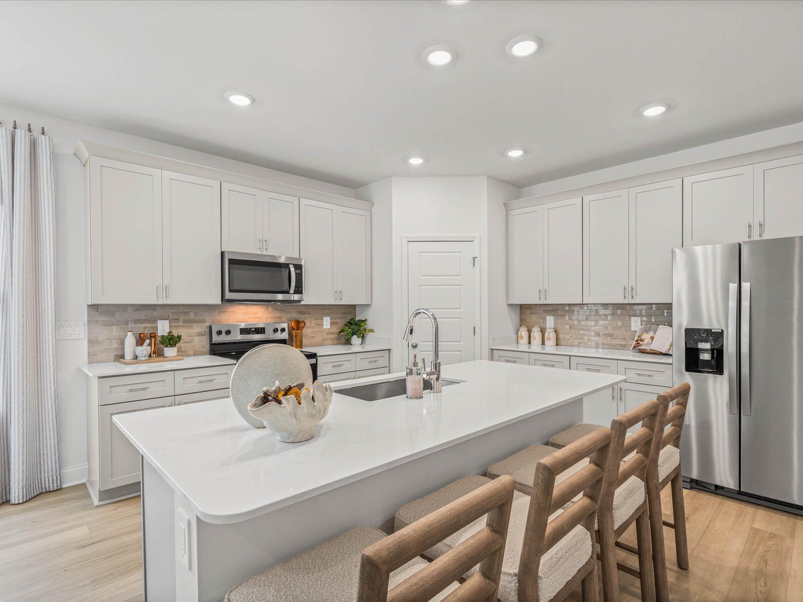 Kitchen in the Newport floorplan at a Meritage Homes community in Gulfport, MS.