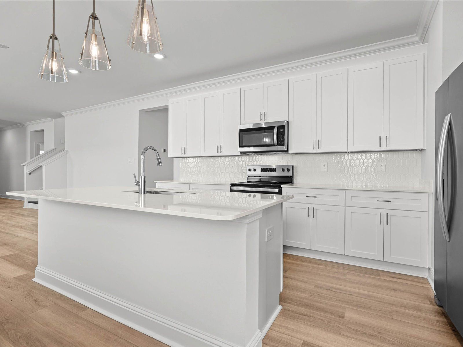Kitchen in the Mackenzie floorplan at a Meritage Homes community in Ocean Springs, MS.