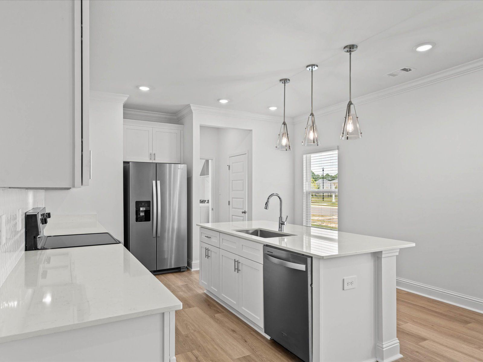 Kitchen in the Mackenzie floorplan at a Meritage Homes community in Ocean Springs, MS.