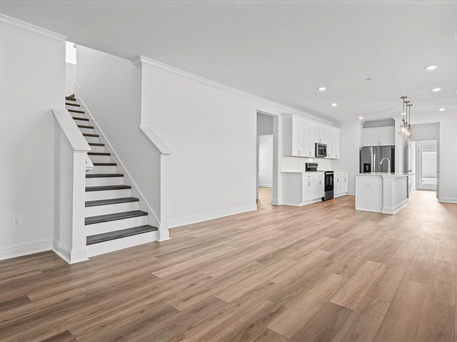 Great Room in the Mackenzie floorplan at a Meritage Homes community in Ocean Springs, MS.