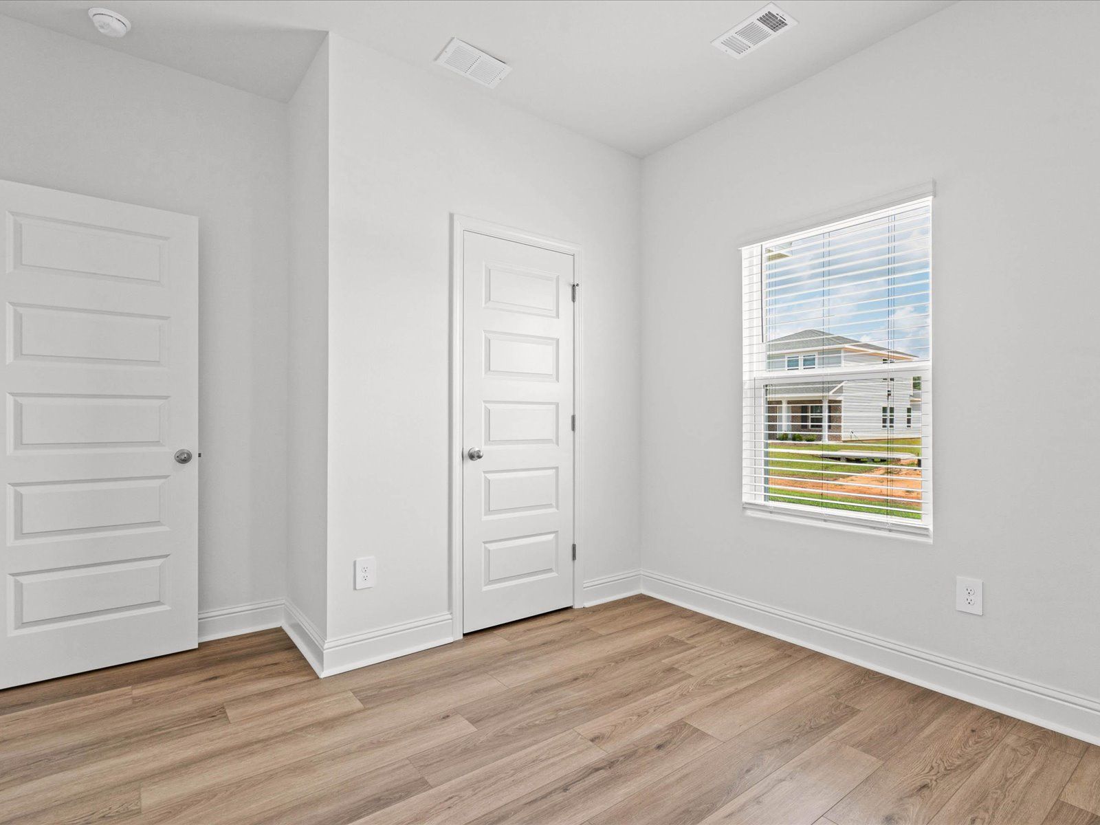 Secondary Bedroom in the Mackenzie floorplan at a Meritage Homes community in Ocean Springs, MS.