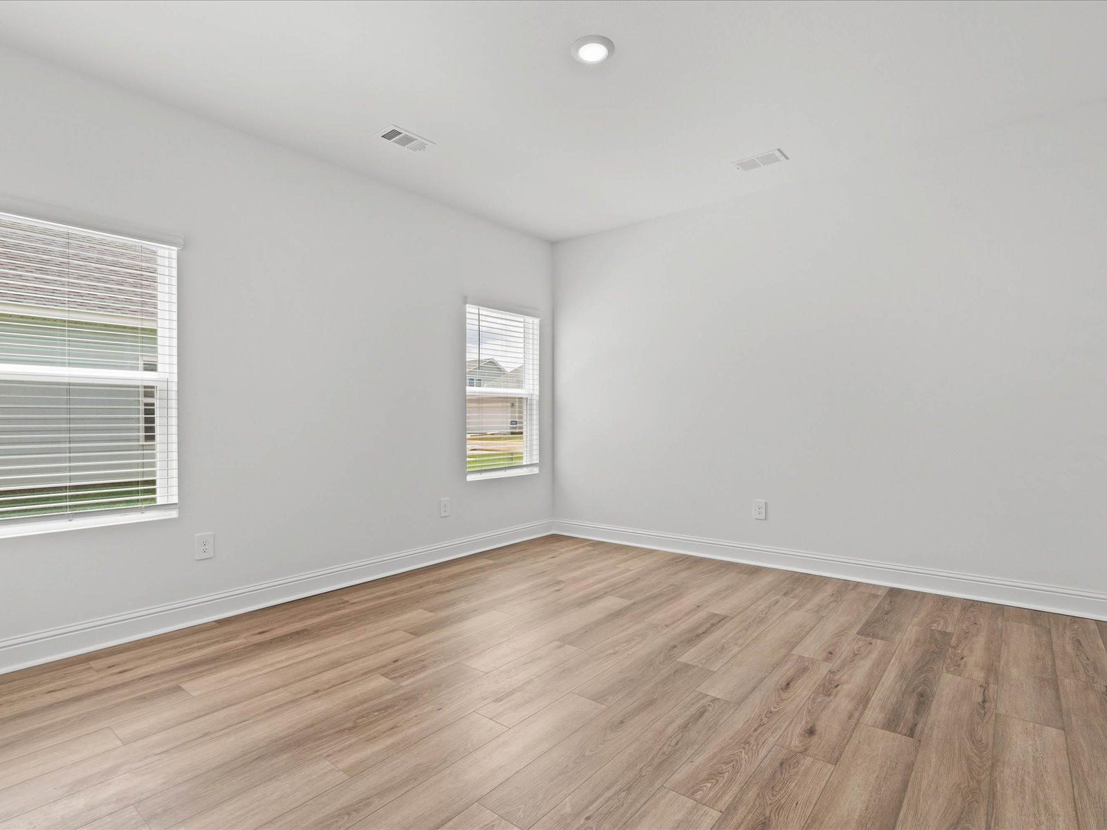 Primary Bedroom in the Mackenzie floorplan at a Meritage Homes community in Ocean Springs, MS.