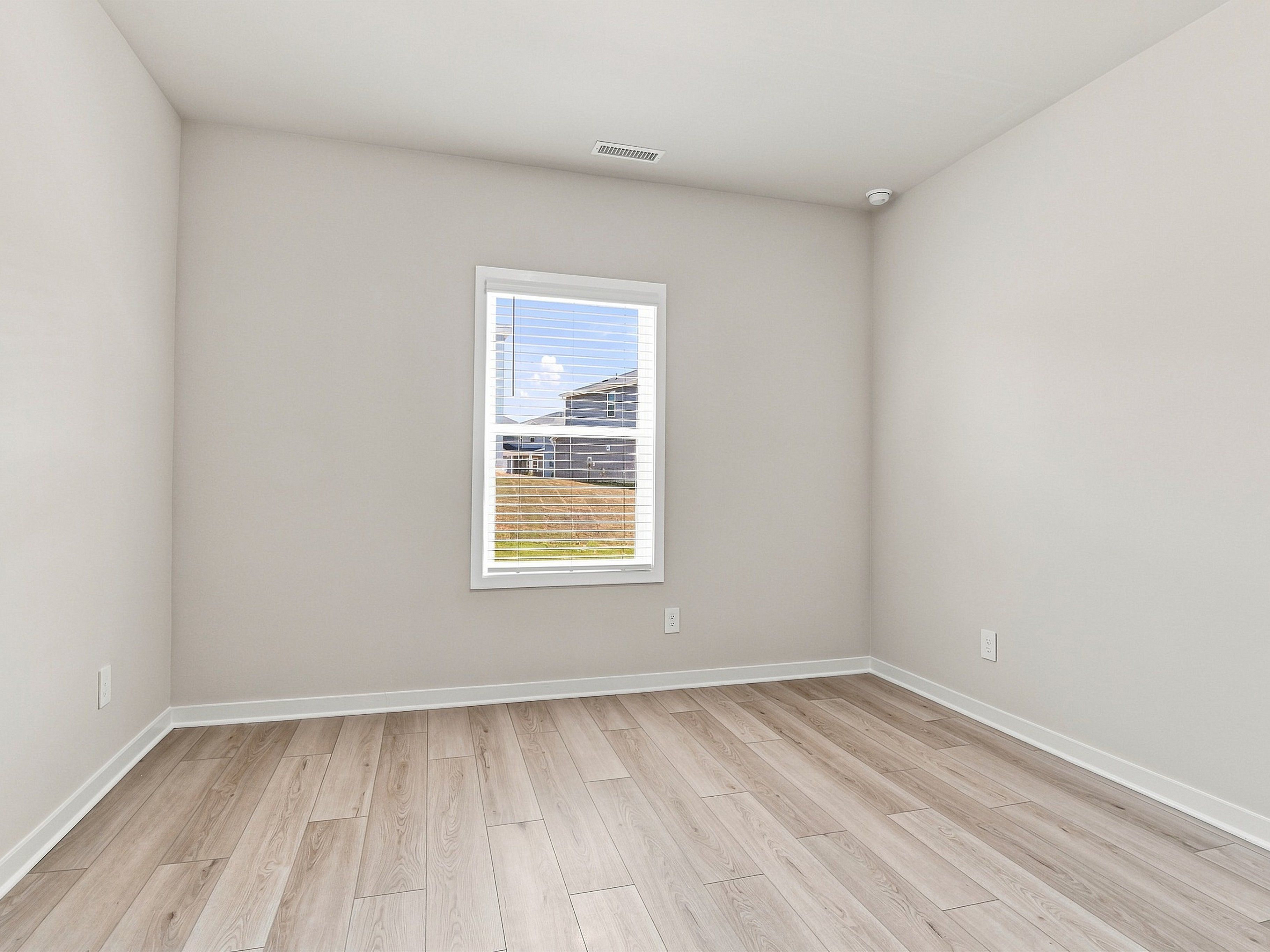 Secondary bedroom in the Paisley floorplan at a Meritage Homes community in Durham, NC.
