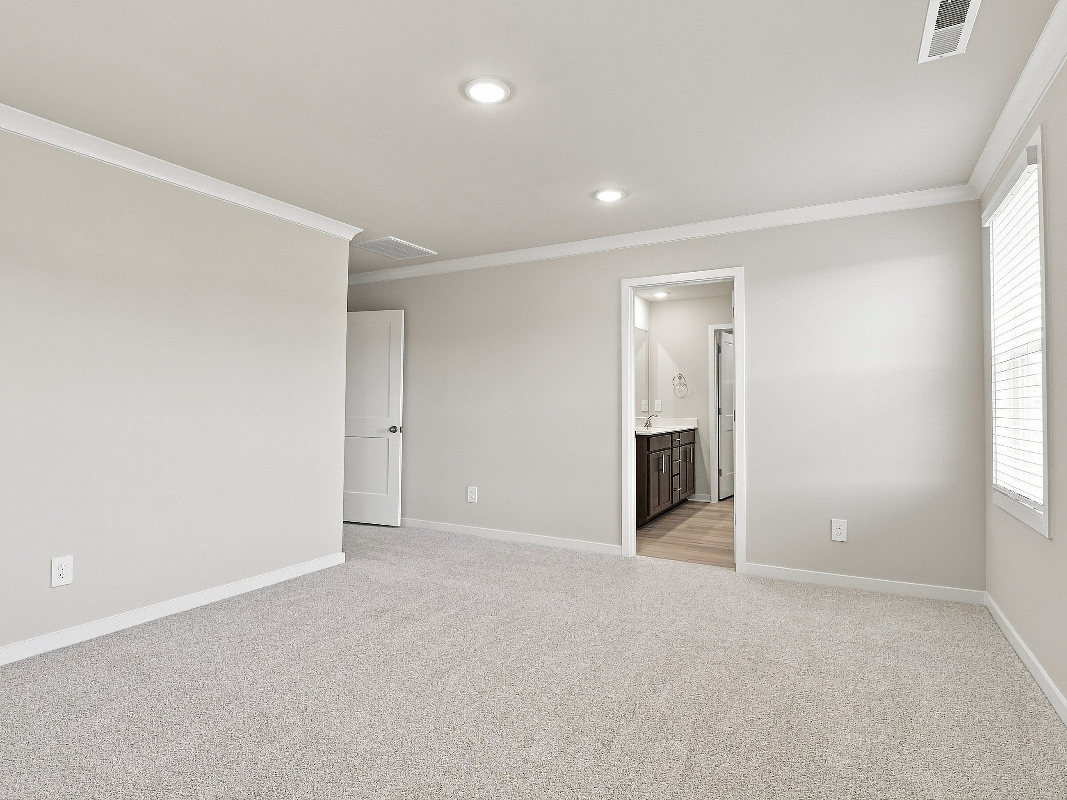 Primary bedroom in the Paisley floorplan at a Meritage Homes community in Durham, NC.