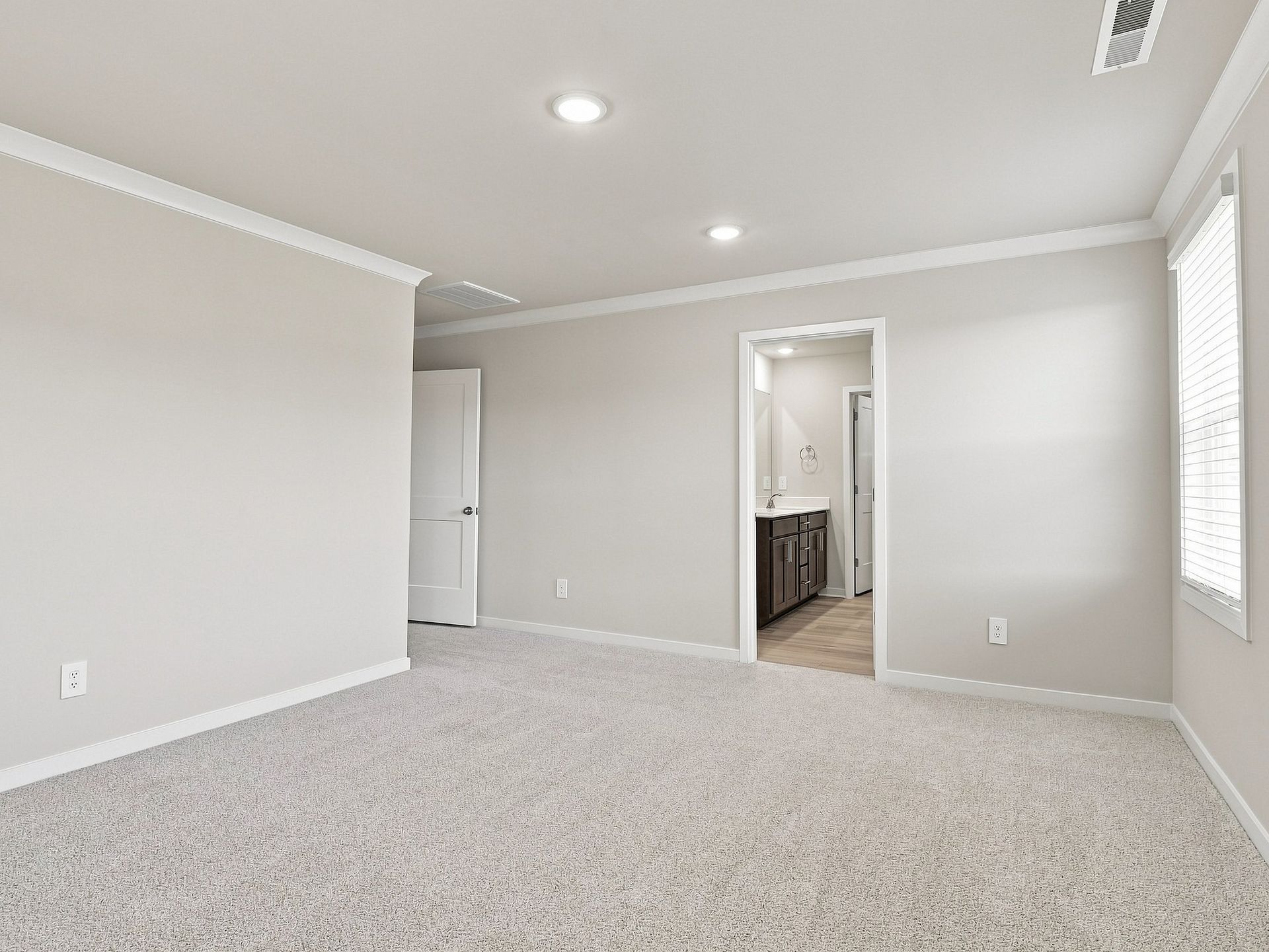 Primary bedroom in the Paisley floorplan at a Meritage Homes community in Durham, NC.