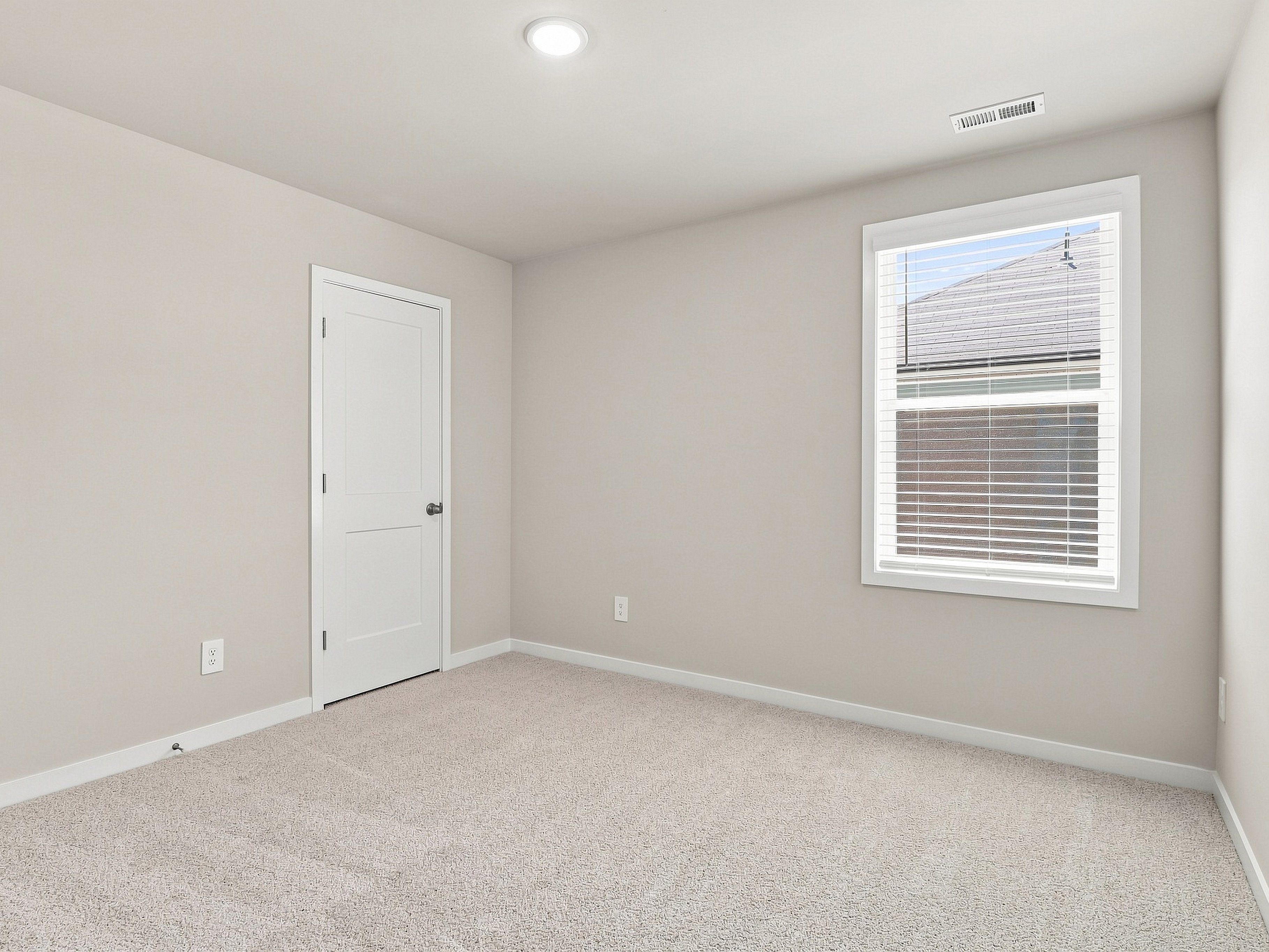 Secondary bedroom in the Paisley floorplan at a Meritage Homes community in Durham, NC.