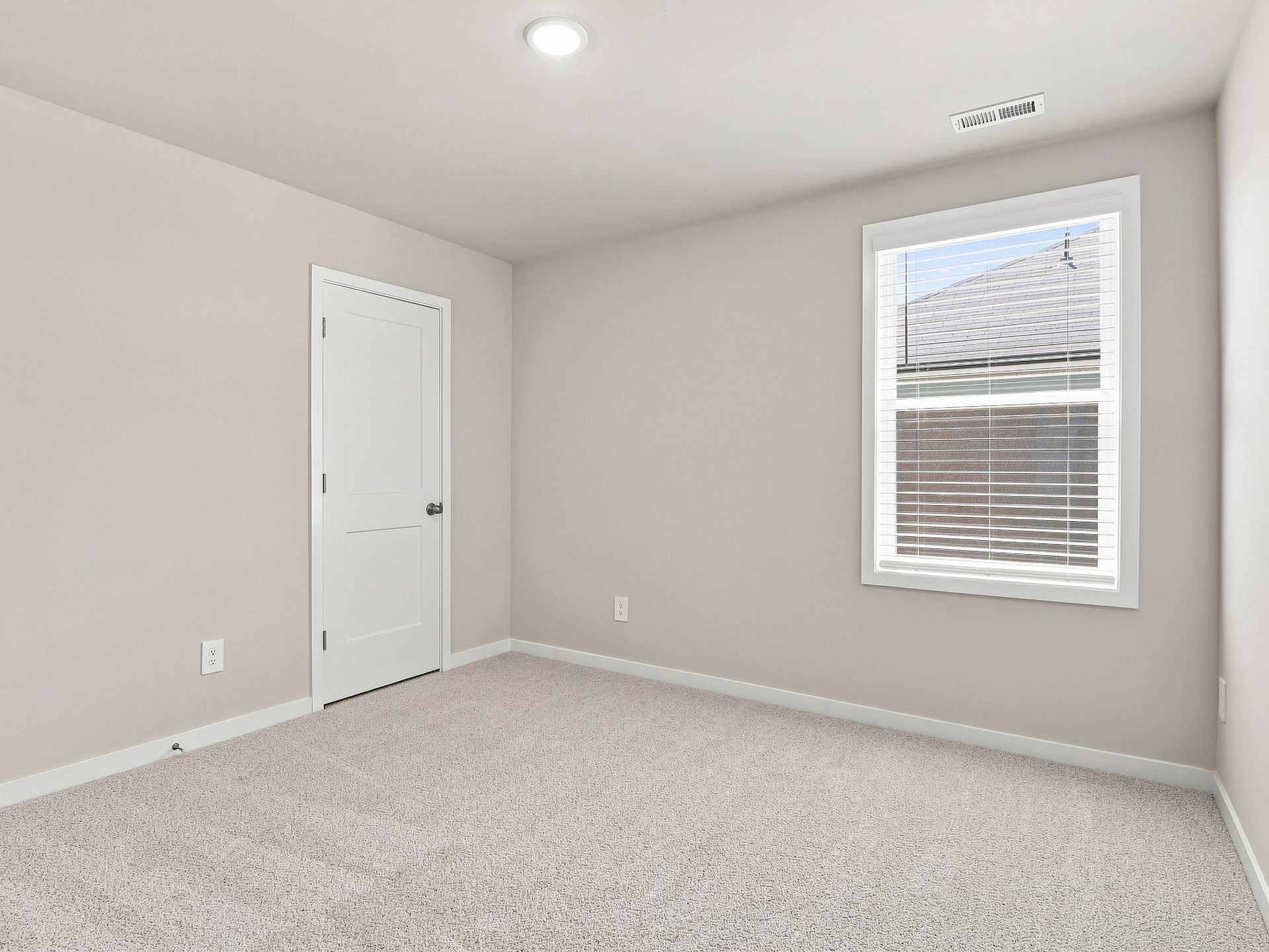 Secondary bedroom in the Paisley floorplan at a Meritage Homes community in Durham, NC.