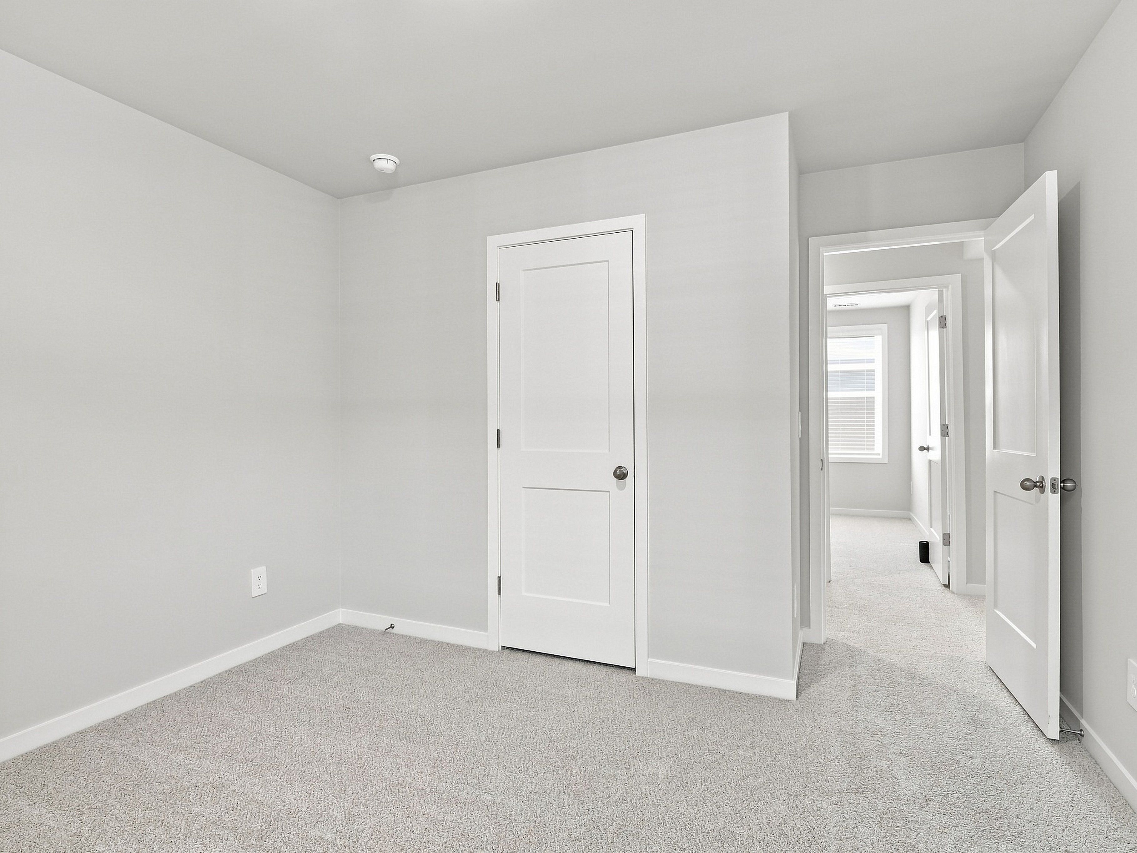 Secondary bedroom in the Paisley floorplan at a Meritage Homes community in Durham, NC.