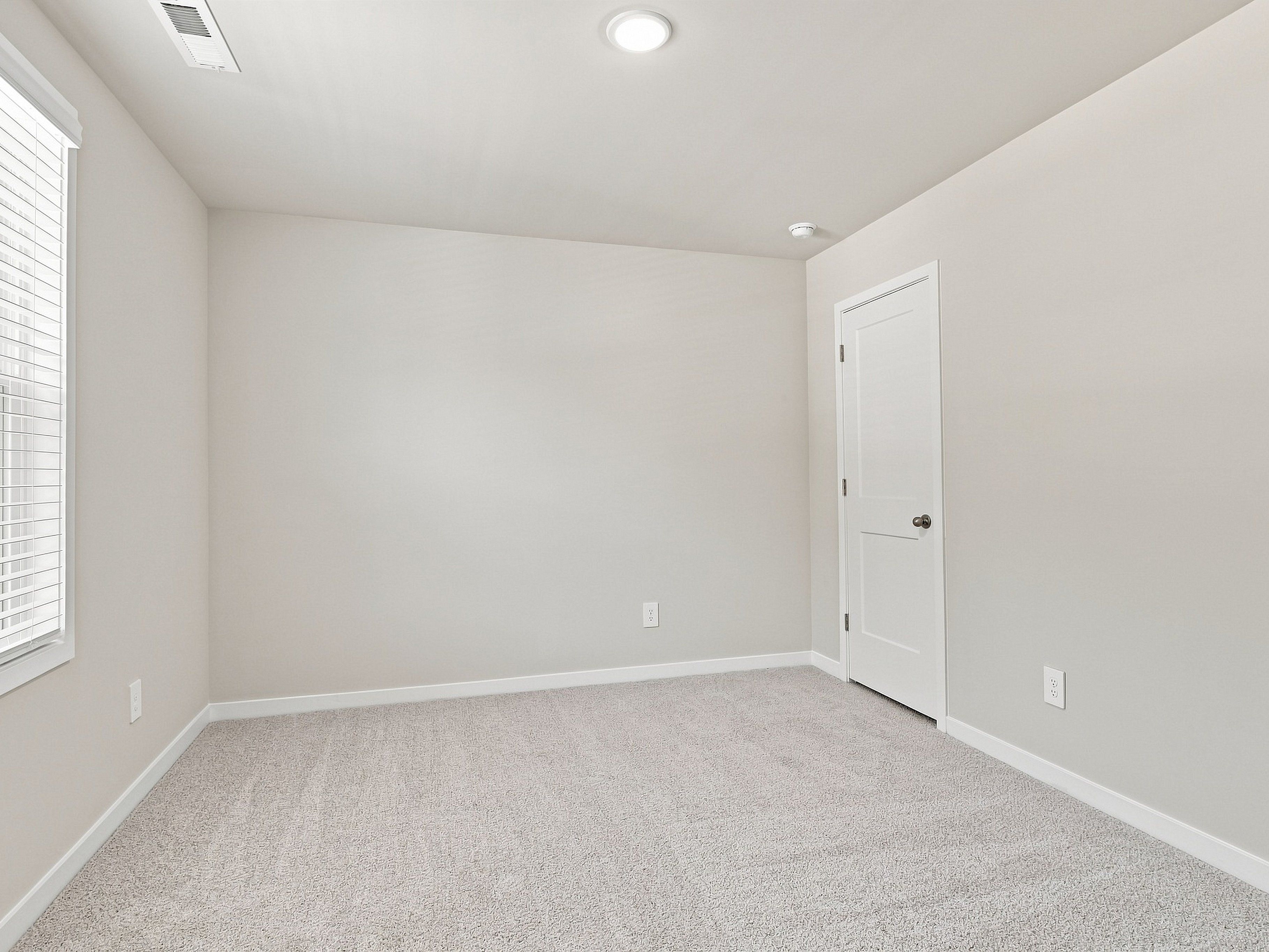 Secondary bedroom in the Paisley floorplan at a Meritage Homes community in Durham, NC.