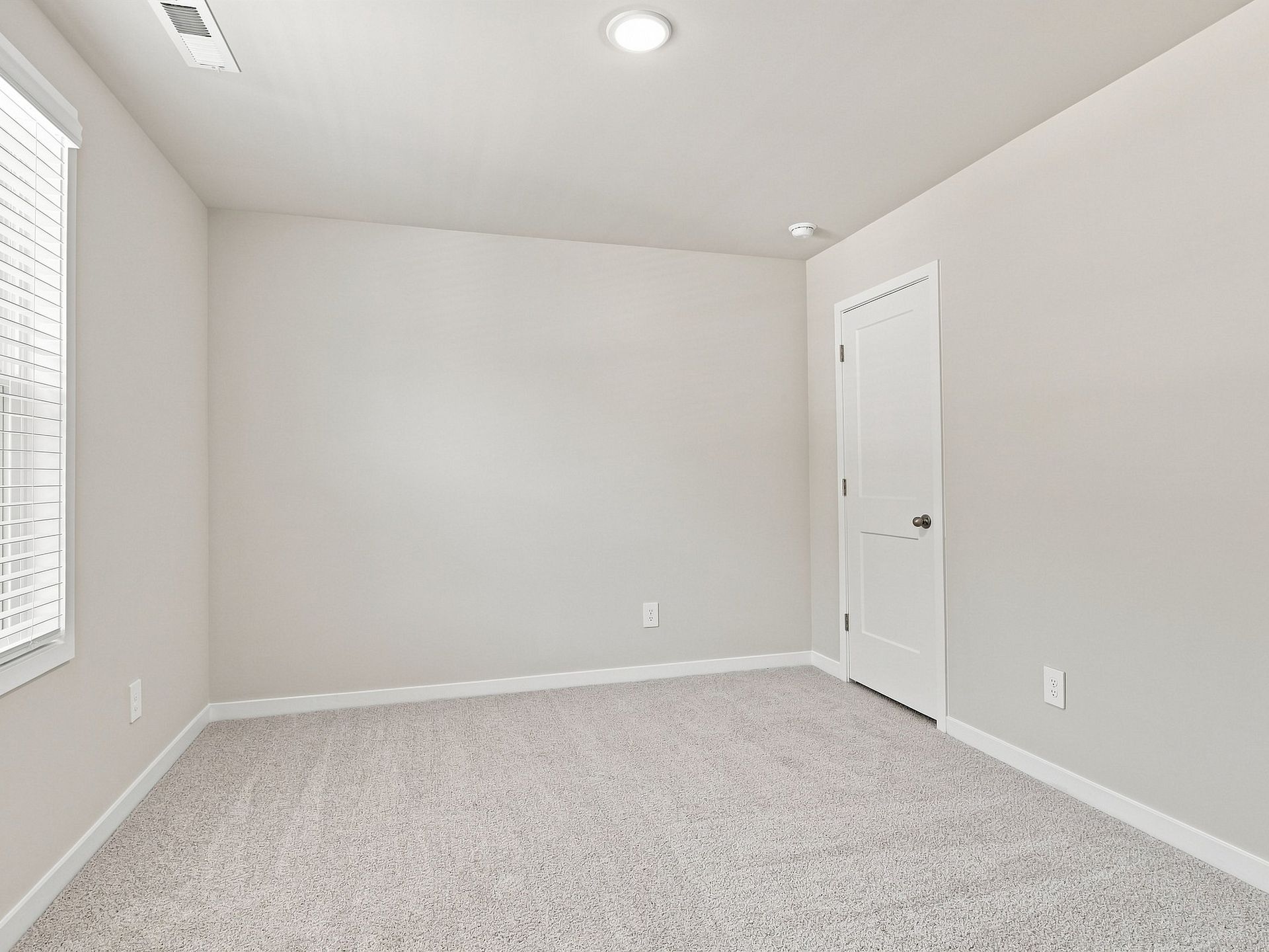 Secondary bedroom in the Paisley floorplan at a Meritage Homes community in Durham, NC.