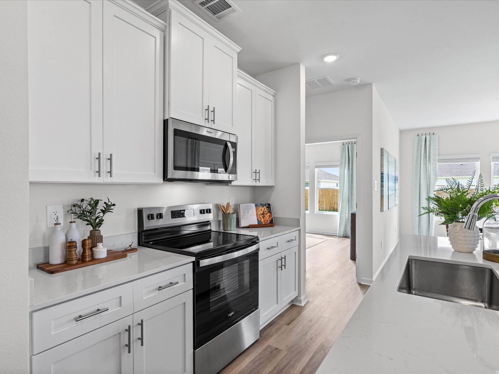 Kitchen in the Chandler floorplan at a Meritage Homes community in Summerdale, AL.