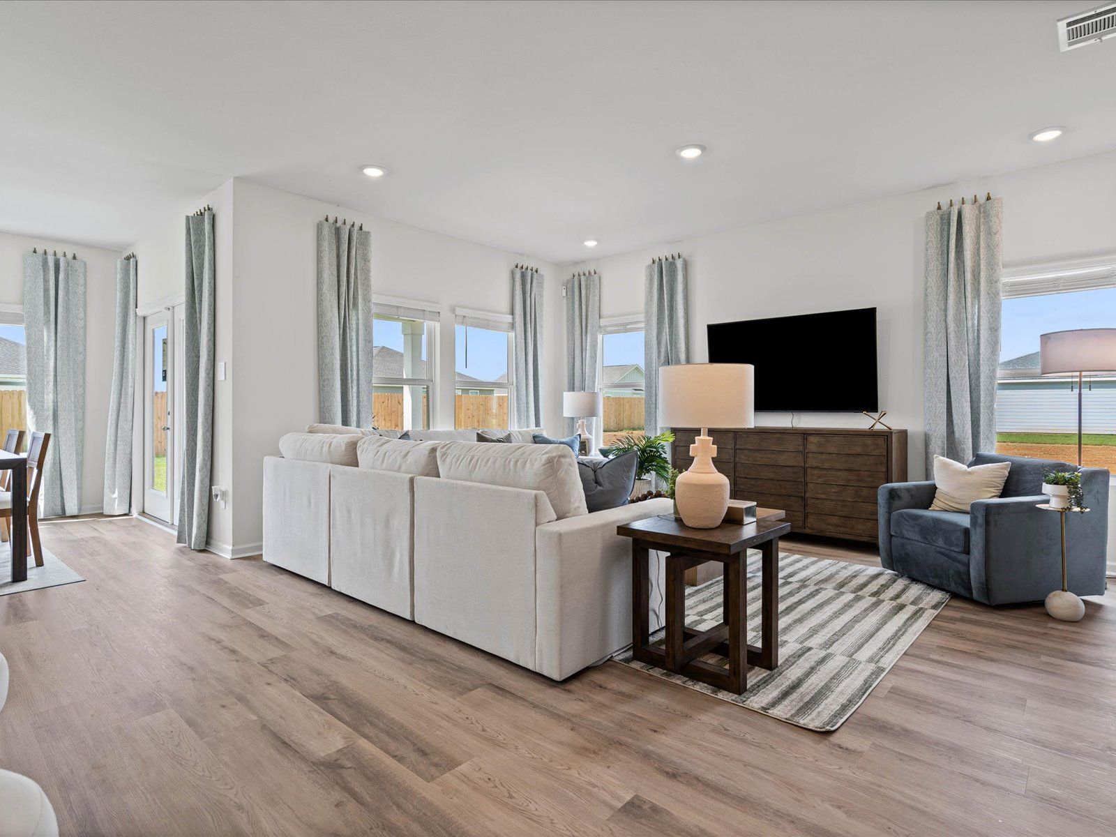 Great room in the Chandler floorplan at a Meritage Homes community in Summerdale, AL.