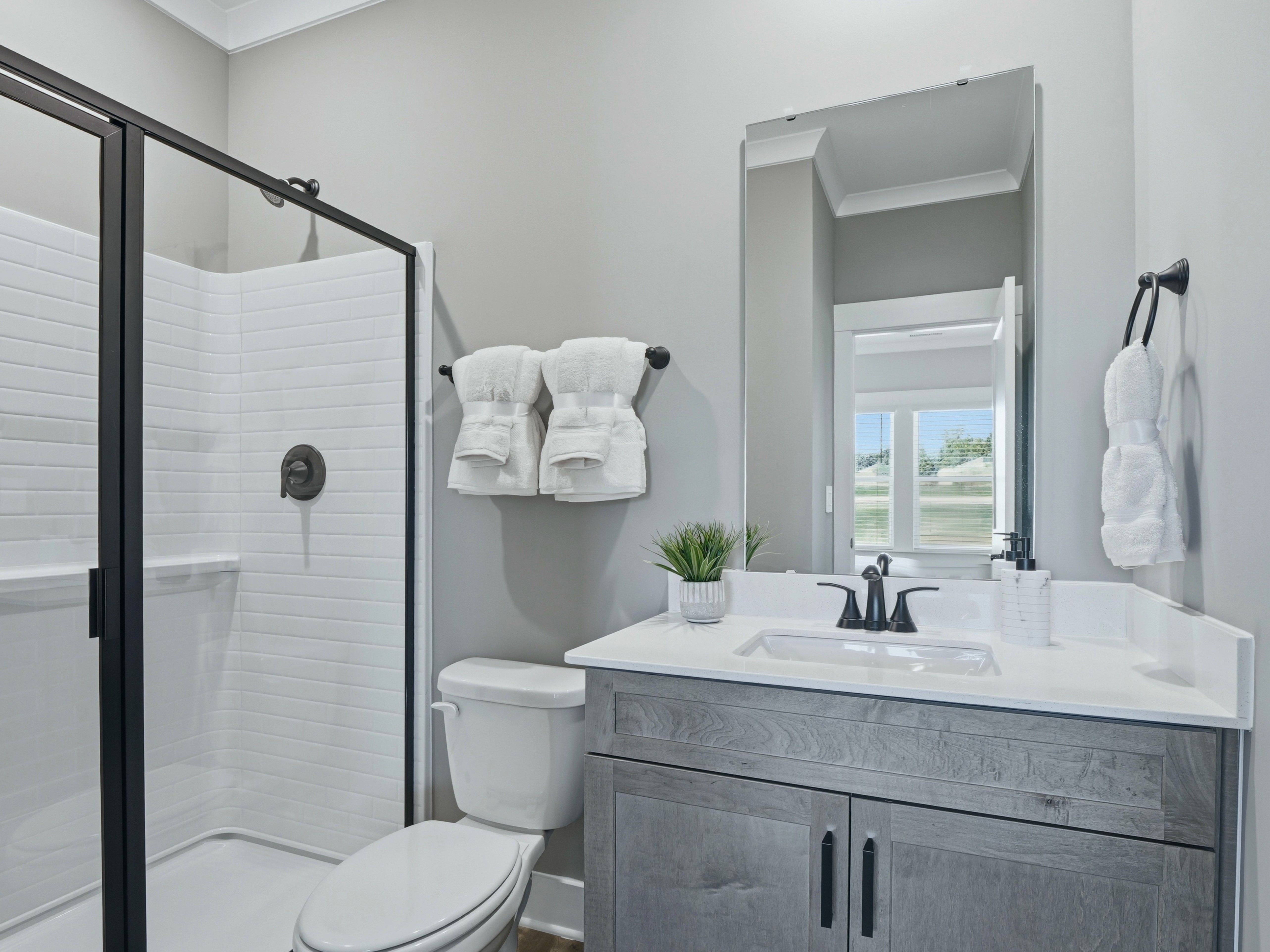 Secondary bathroom in the Taylorsville floorplan at a Meritage Homes community in Zebulon, NC.