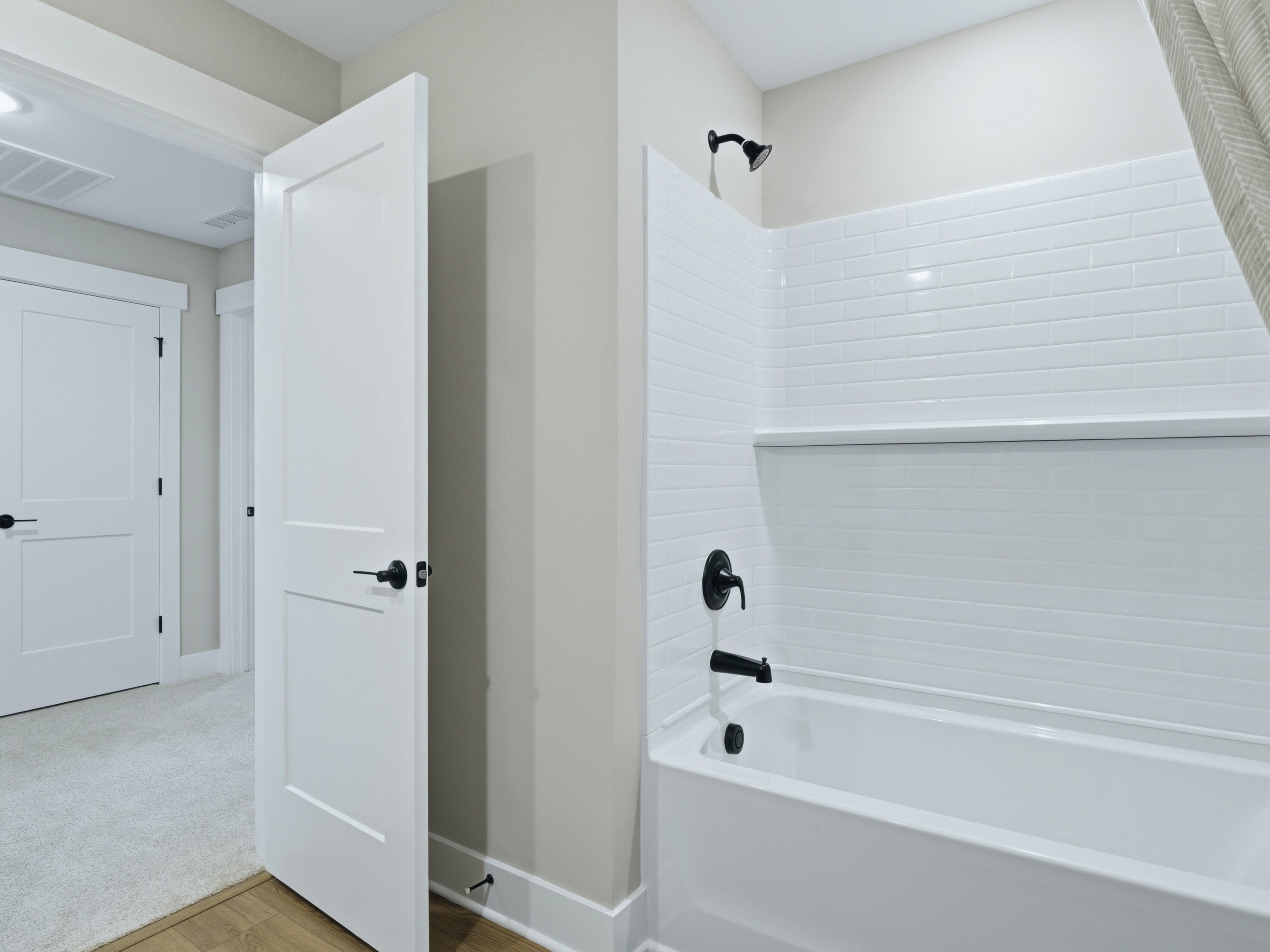 Secondary bathroom in the Taylorsville floorplan at a Meritage Homes community in Zebulon, NC.