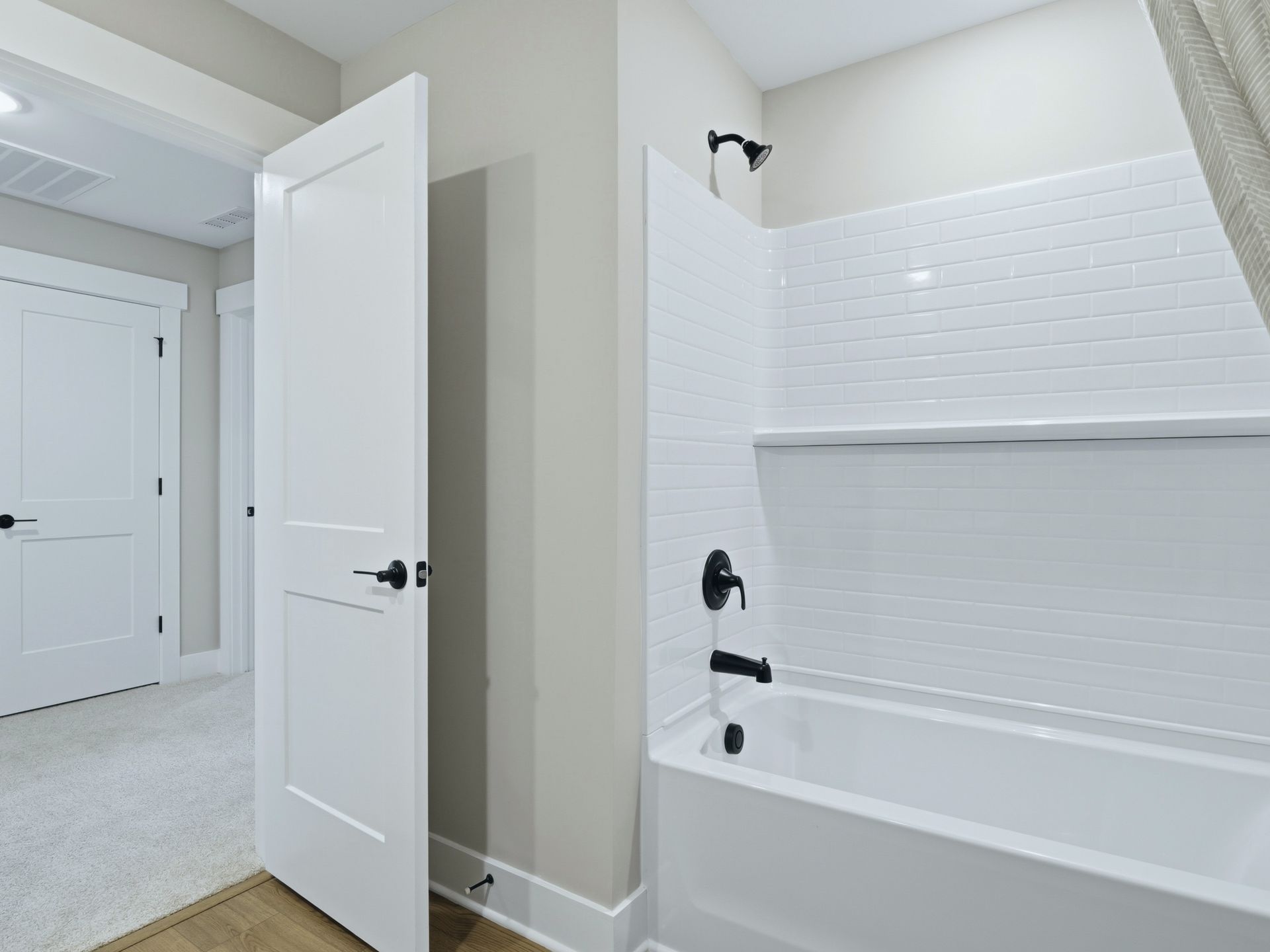 Secondary bathroom in the Taylorsville floorplan at a Meritage Homes community in Zebulon, NC.