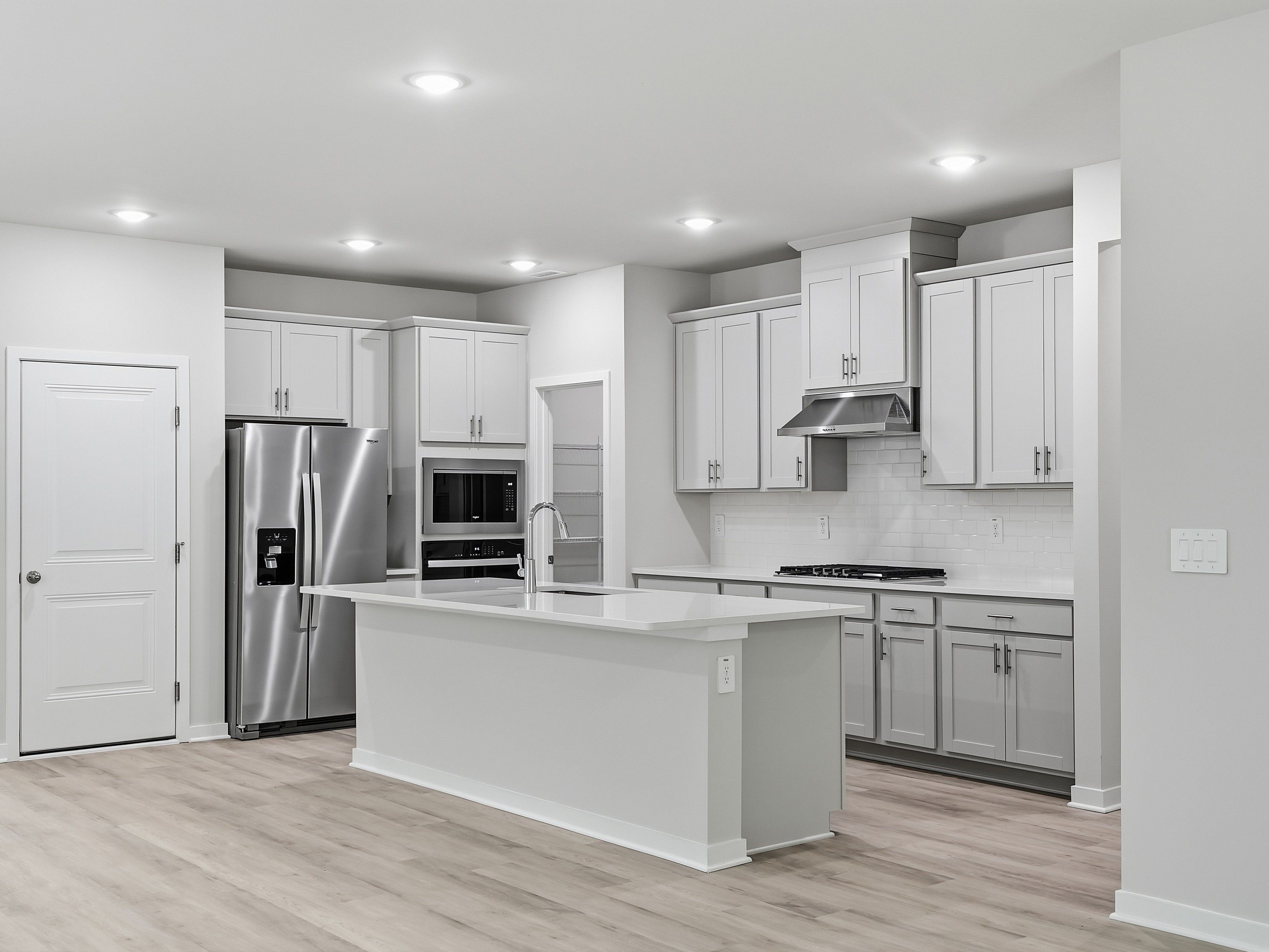 Kitchen in the Paisley floorplan at a Meritage Homes community in Clayton, NC.