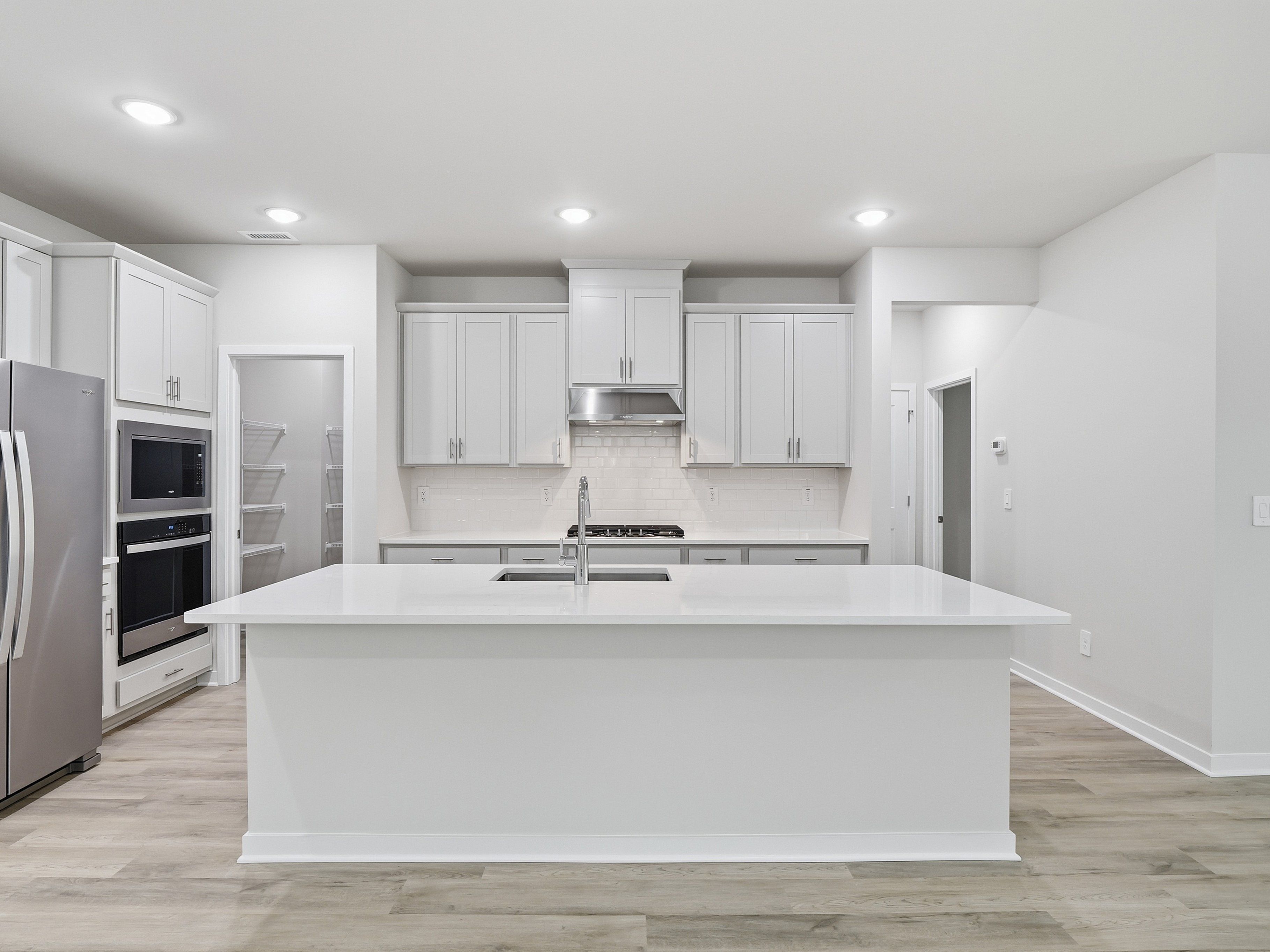 Kitchen in the Paisley floorplan at a Meritage Homes community in Clayton, NC.