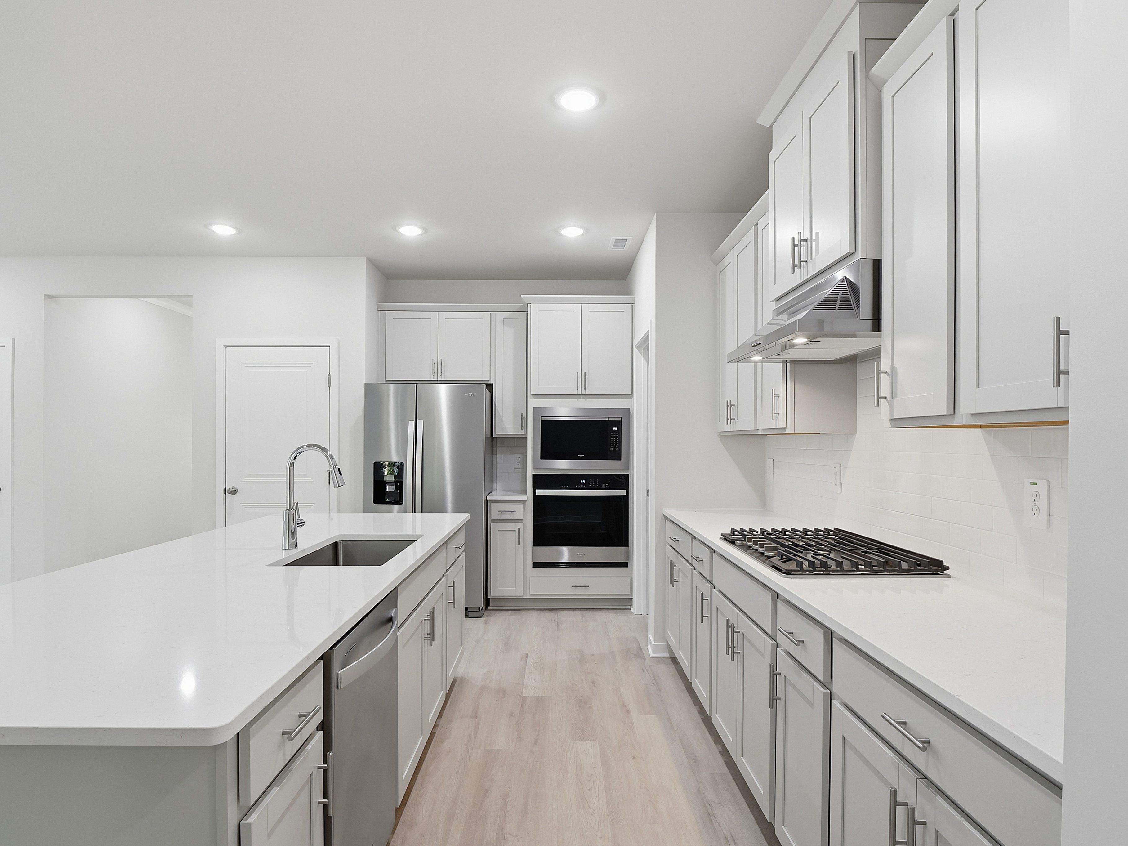 Kitchen in the Paisley floorplan at a Meritage Homes community in Clayton, NC.