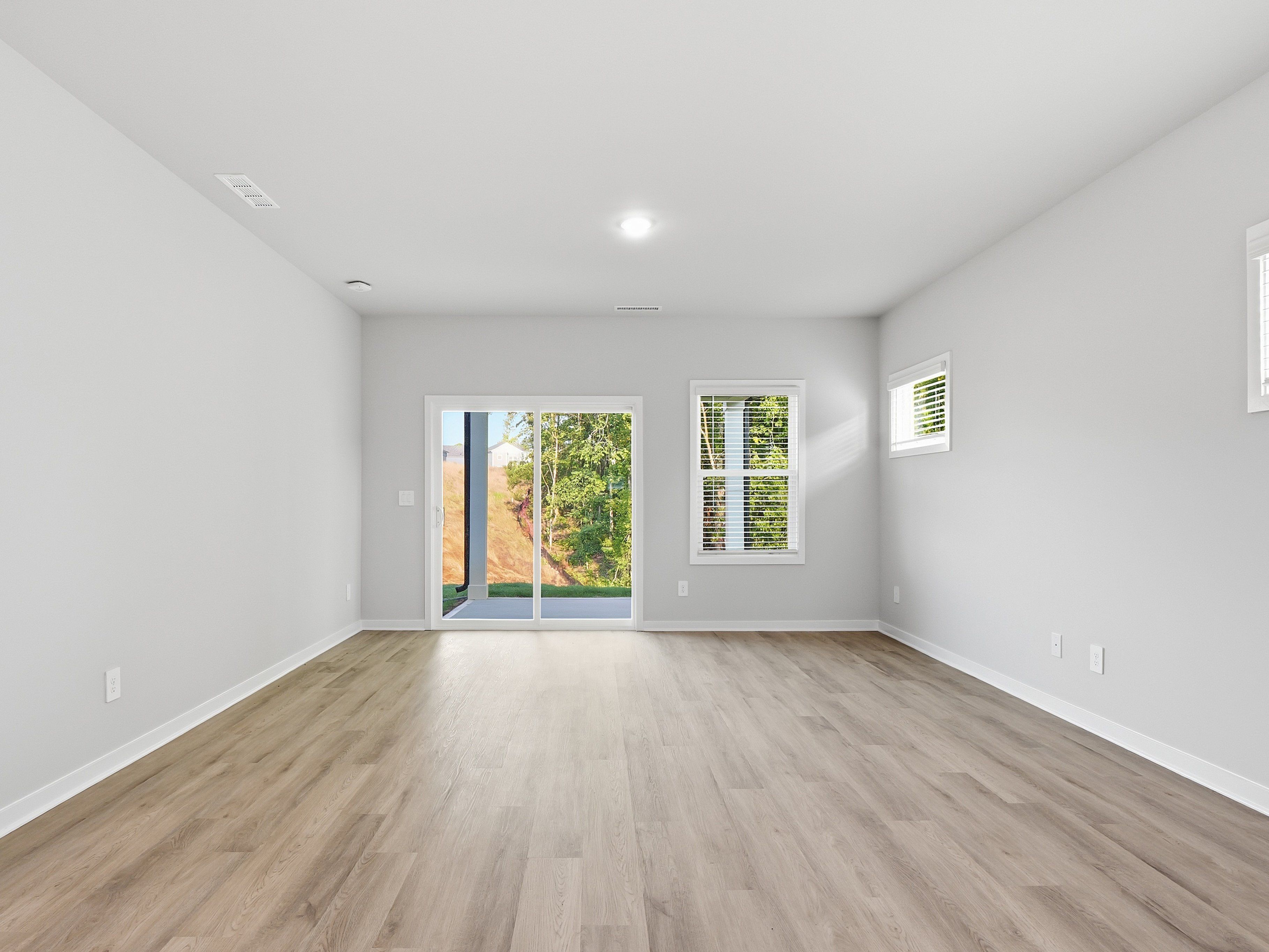 Great room in the Paisley floorplan at a Meritage Homes community in Clayton, NC.