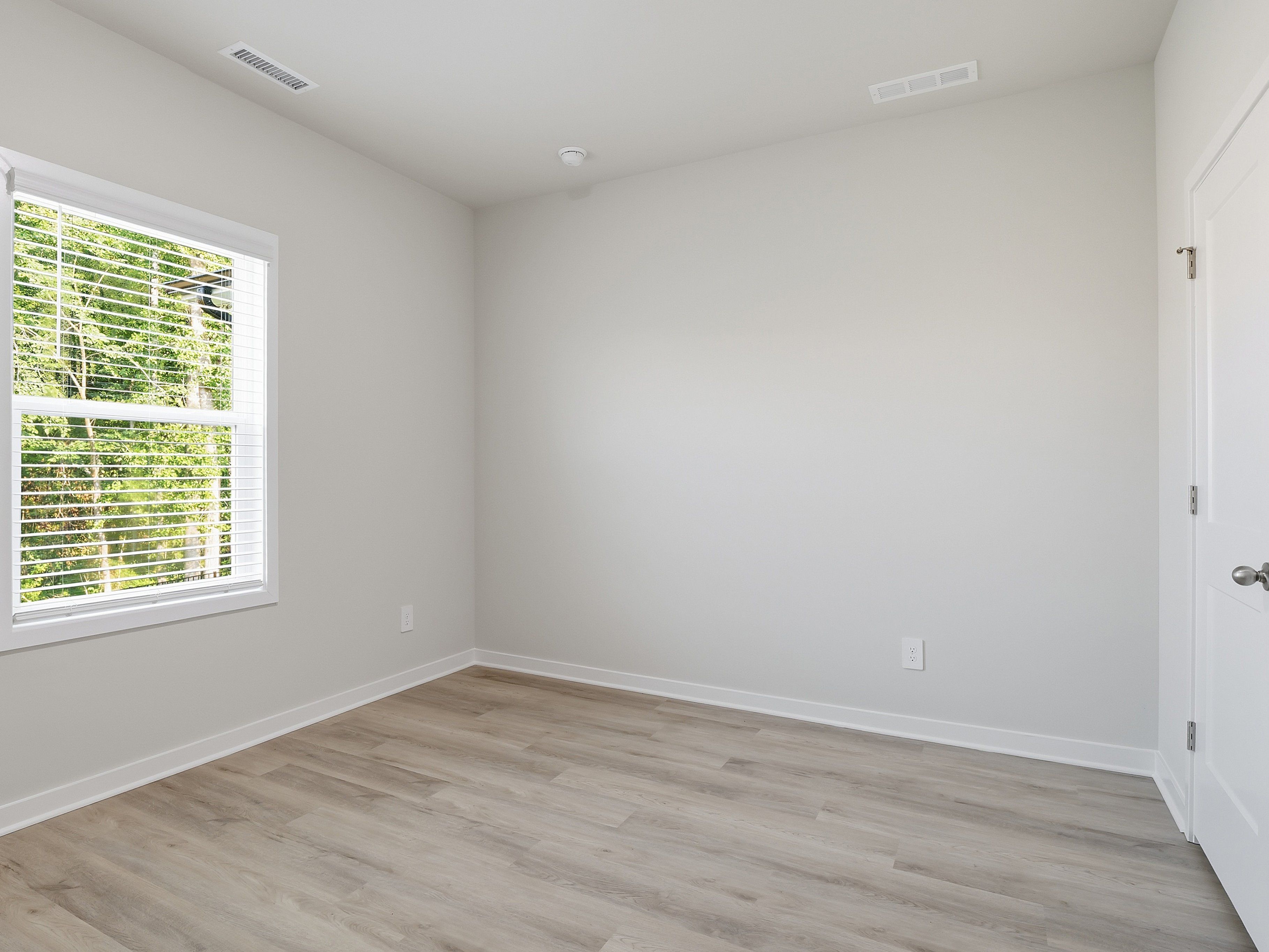 Secondary bedroom in the Paisley floorplan at a Meritage Homes community in Clayton, NC.
