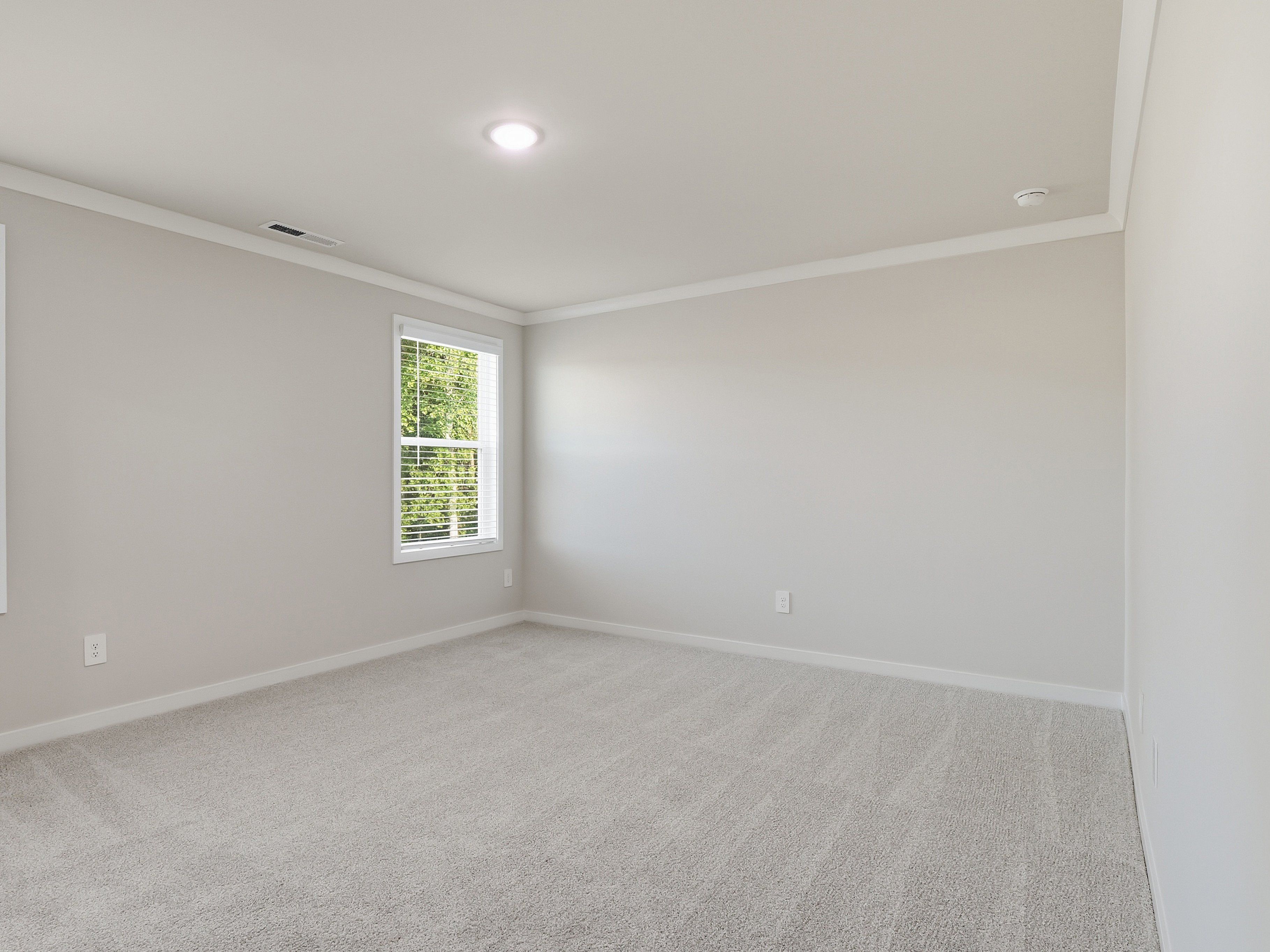 Primary bedroom in the Paisley floorplan at a Meritage Homes community in Clayton, NC.