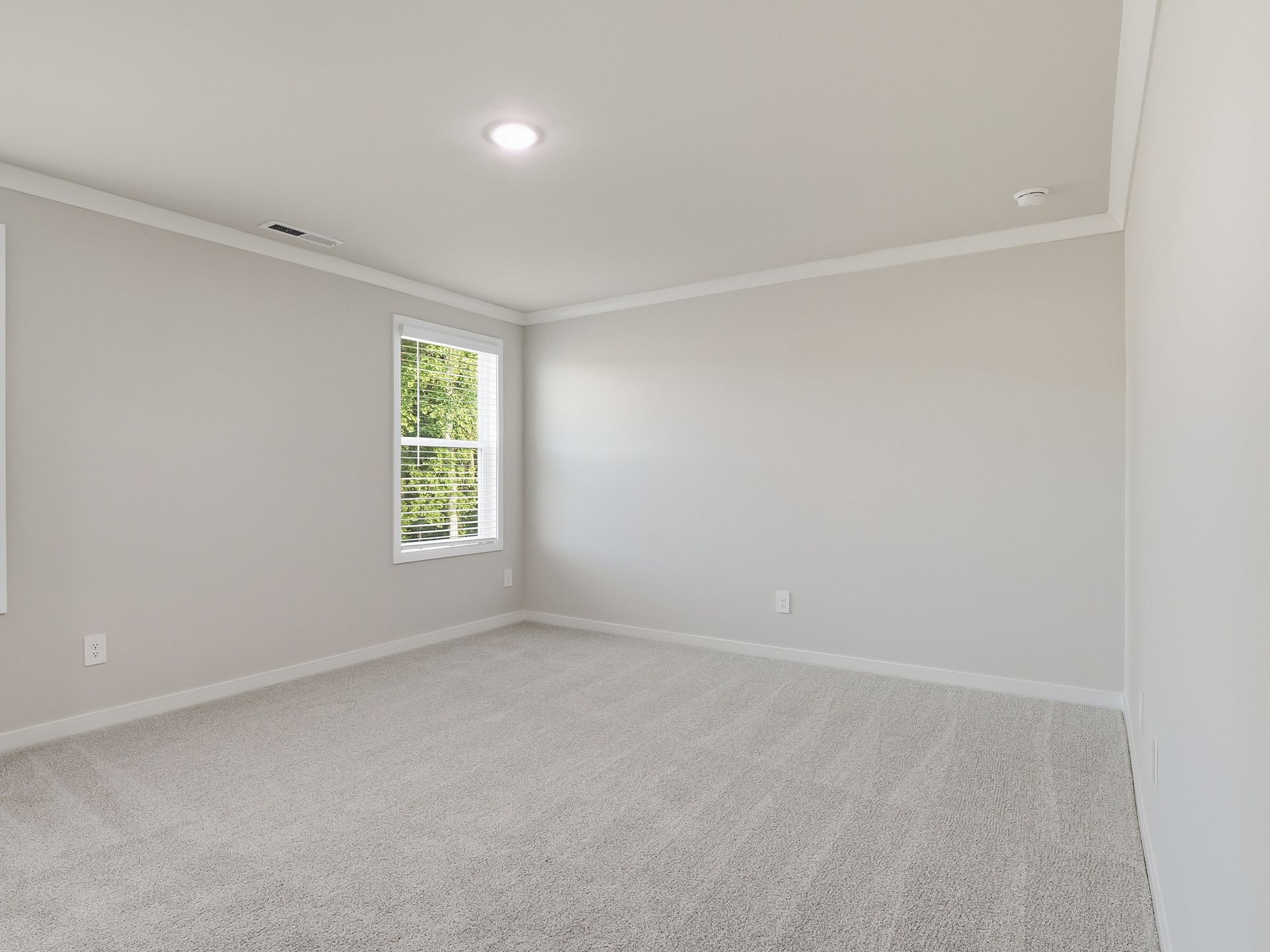Primary bedroom in the Paisley floorplan at a Meritage Homes community in Clayton, NC.