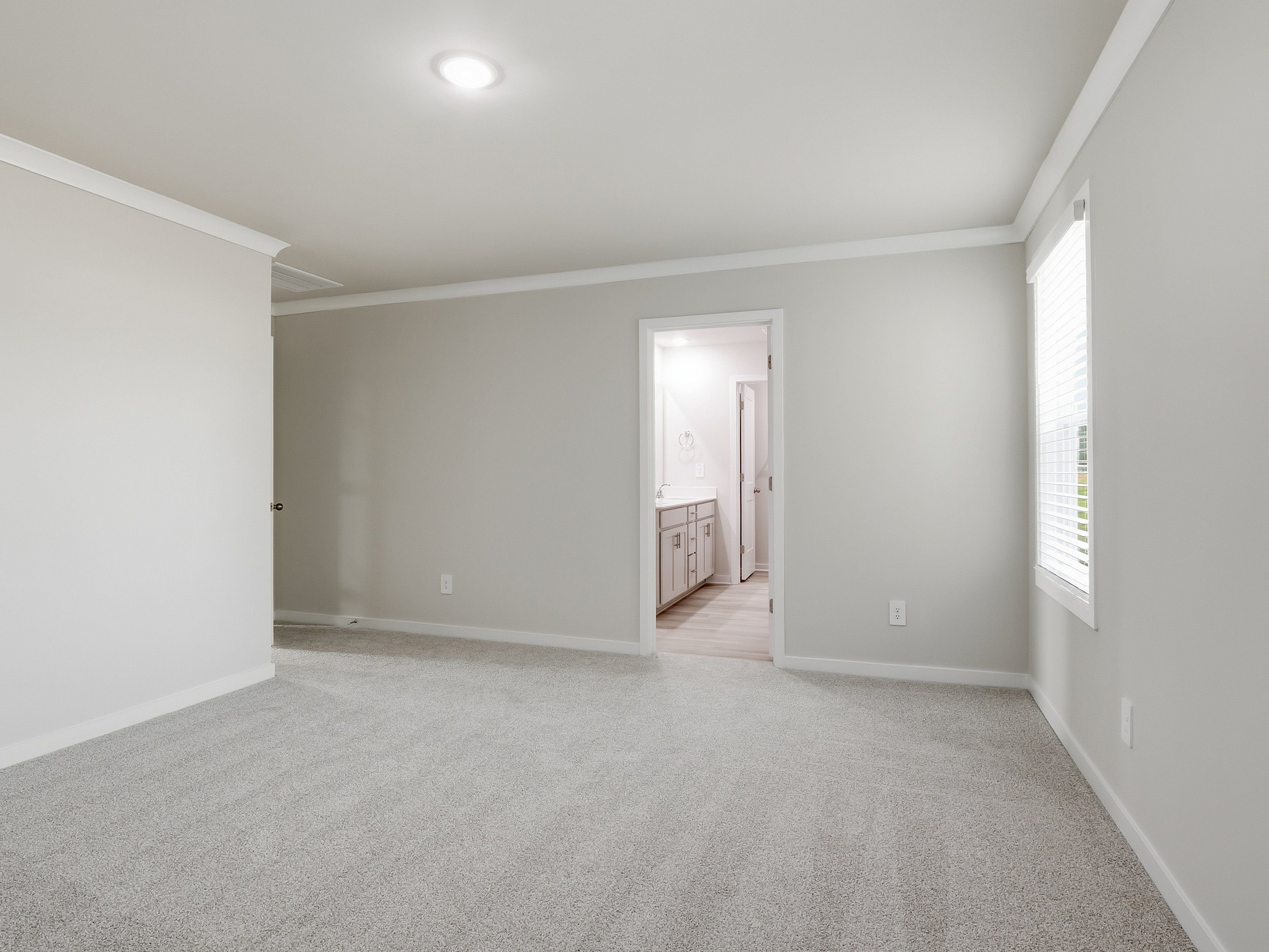 Primary bedroom in the Paisley floorplan at a Meritage Homes community in Clayton, NC.