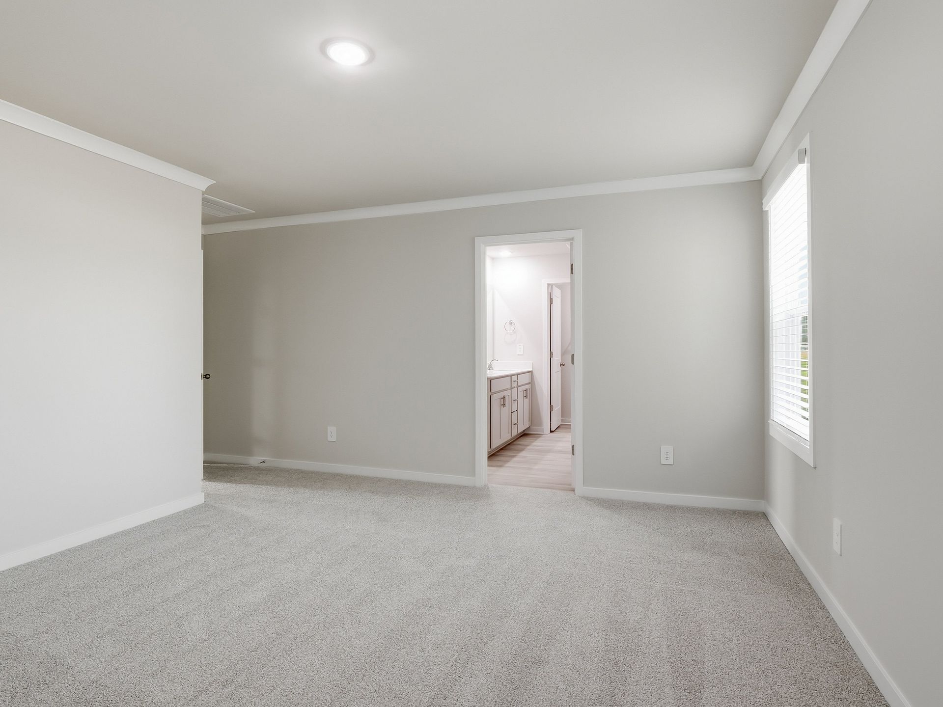 Primary bedroom in the Paisley floorplan at a Meritage Homes community in Clayton, NC.