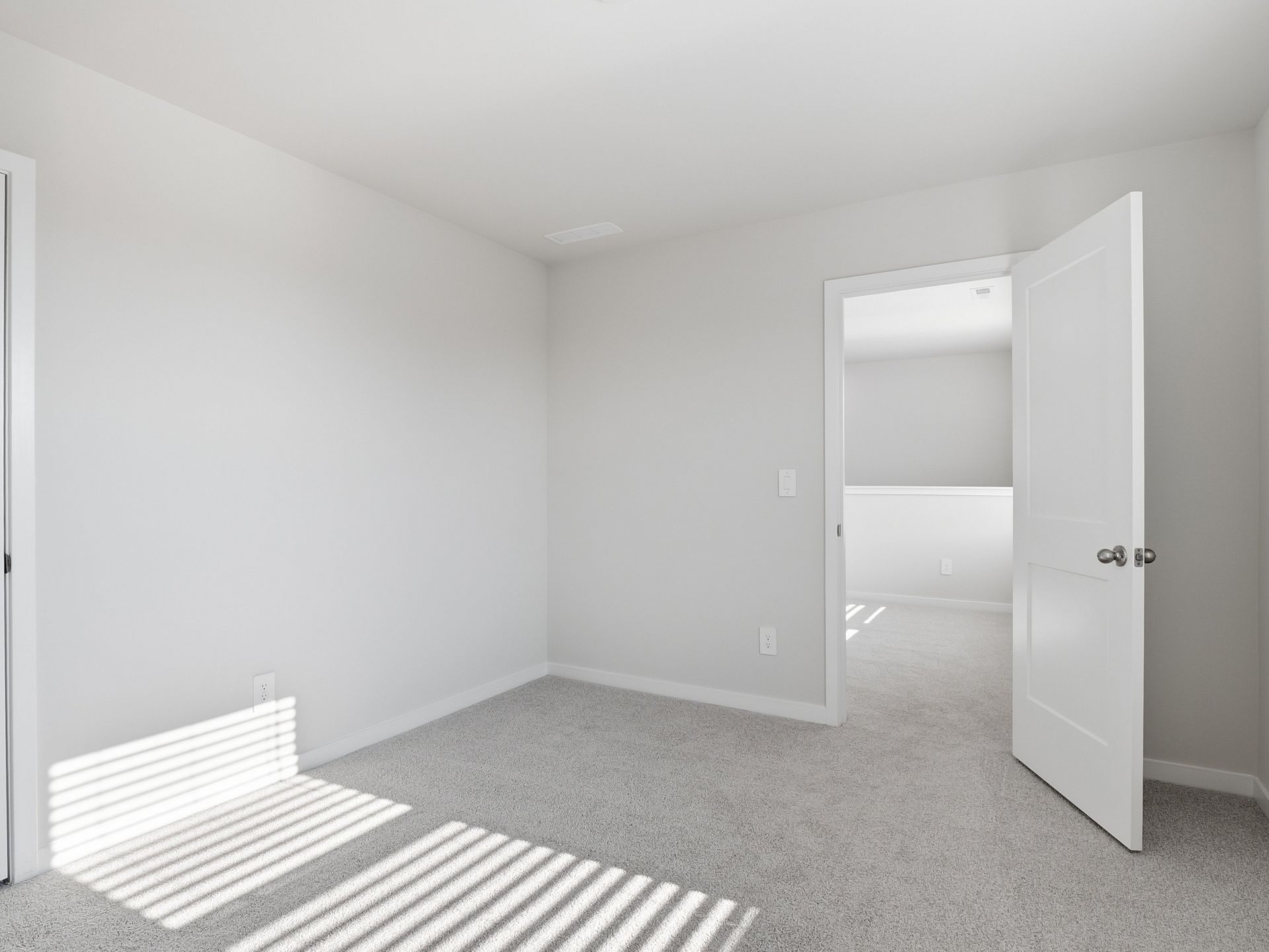 Secondary bedroom in the Paisley floorplan at a Meritage Homes community in Clayton, NC.