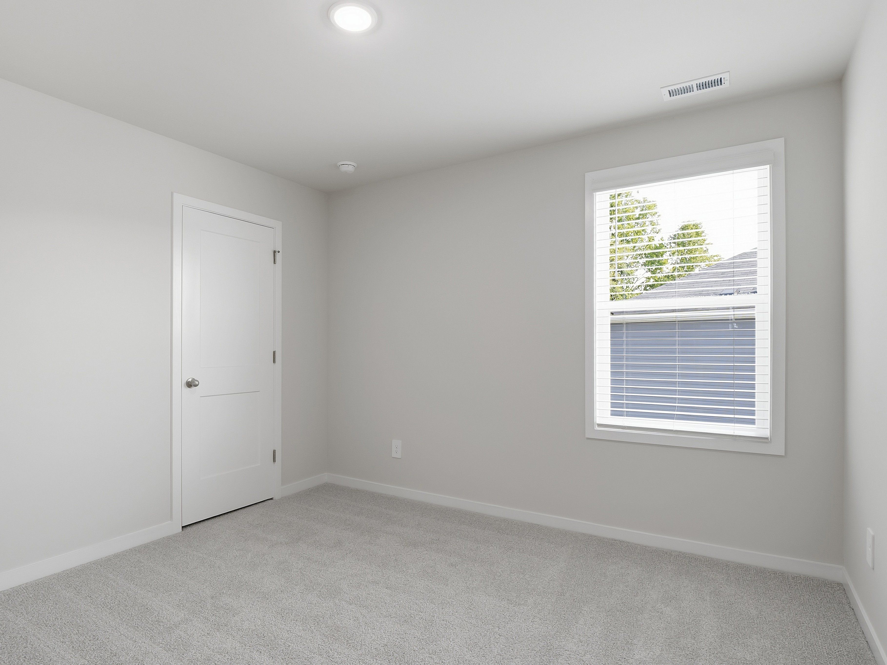 Secondary bedroom in the Paisley floorplan at a Meritage Homes community in Clayton, NC.