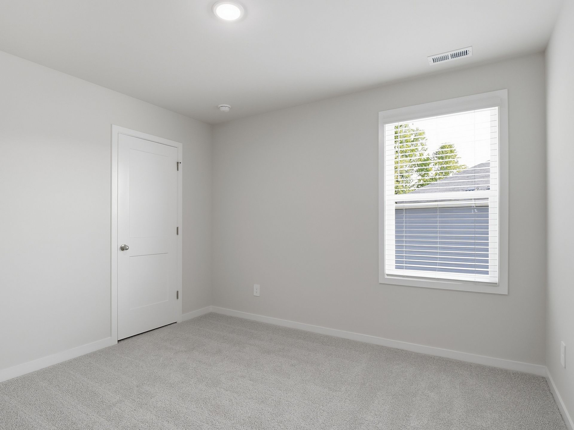 Secondary bedroom in the Paisley floorplan at a Meritage Homes community in Clayton, NC.