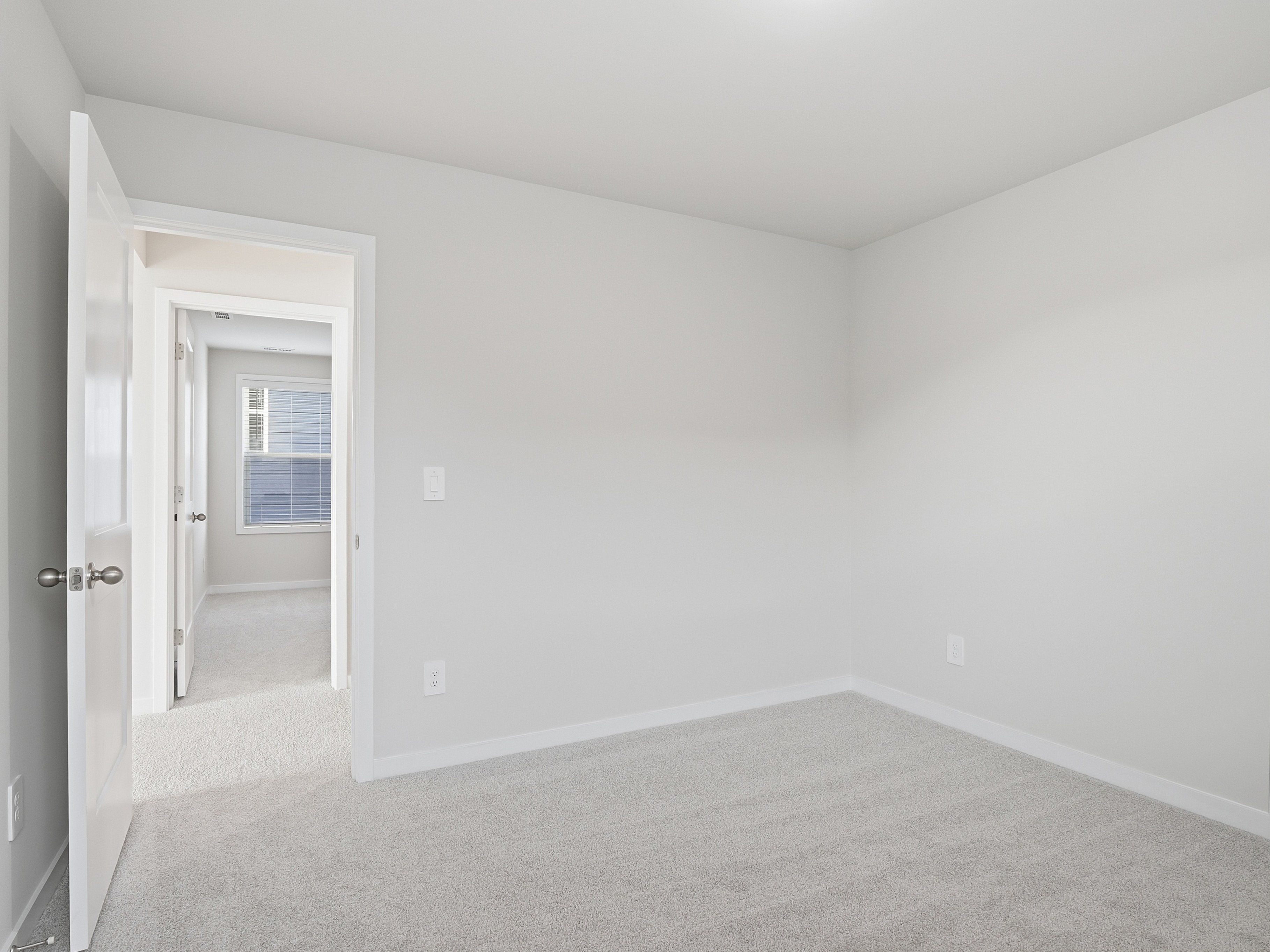 Secondary bedroom in the Paisley floorplan at a Meritage Homes community in Clayton, NC.