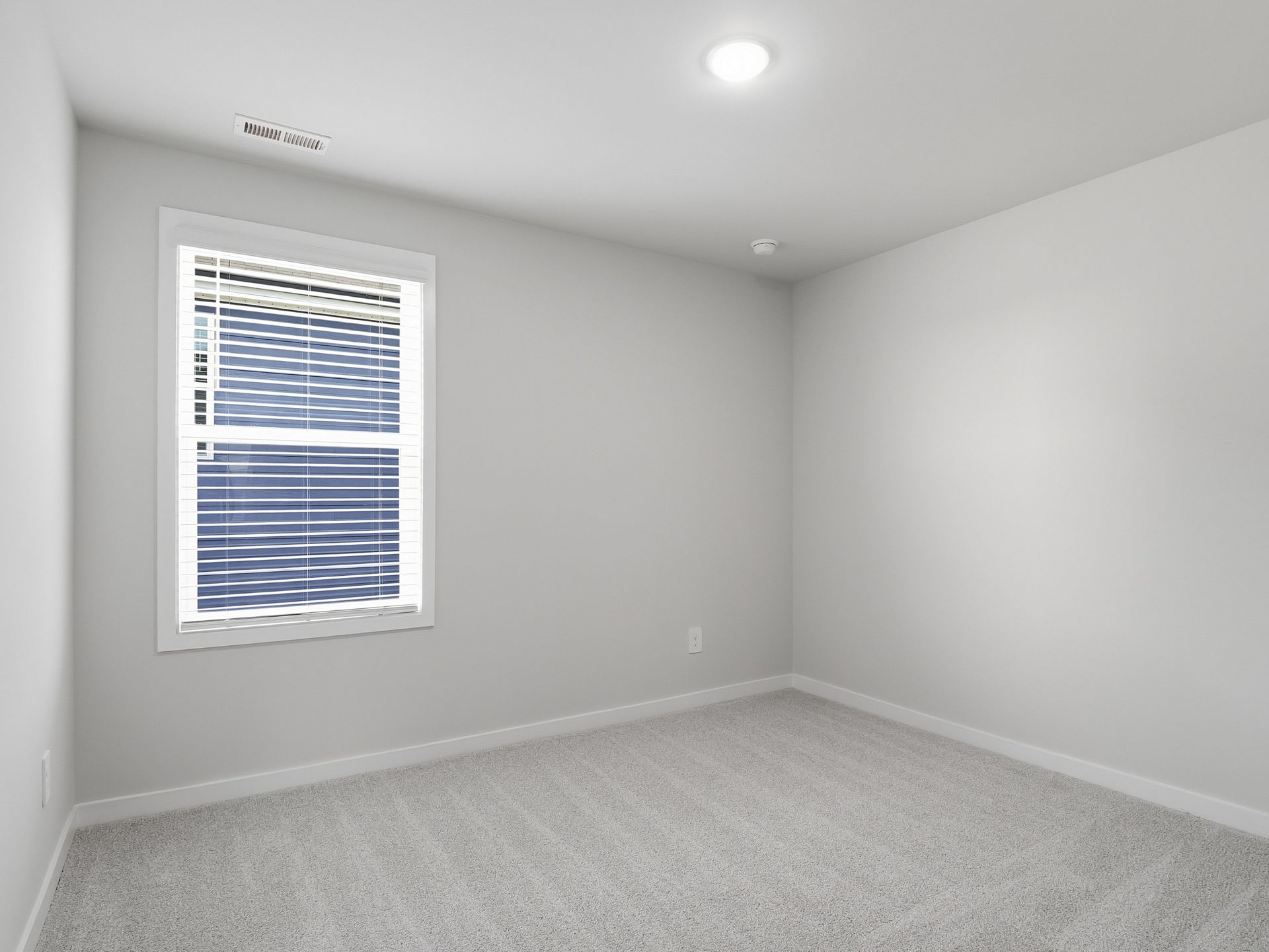 Secondary bedroom in the Paisley floorplan at a Meritage Homes community in Clayton, NC.